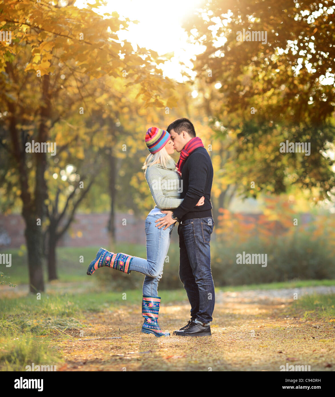 A view of a loving couple kissing in the park Stock Photo - Alamy