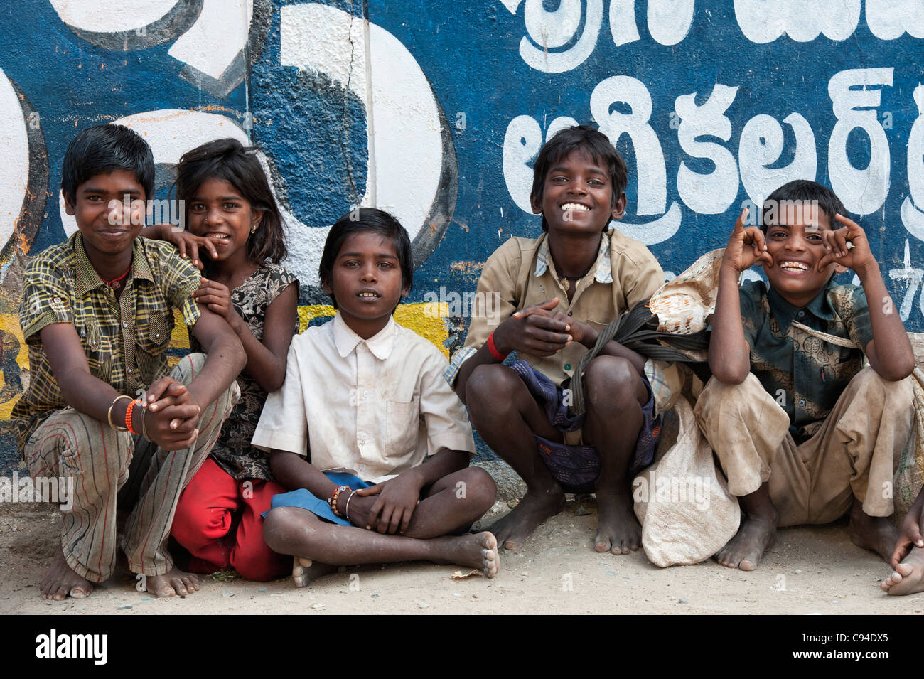 Happy young poor lower caste Indian nomadic street children smiling and laughing. Andhra Pradesh, India Stock Photo