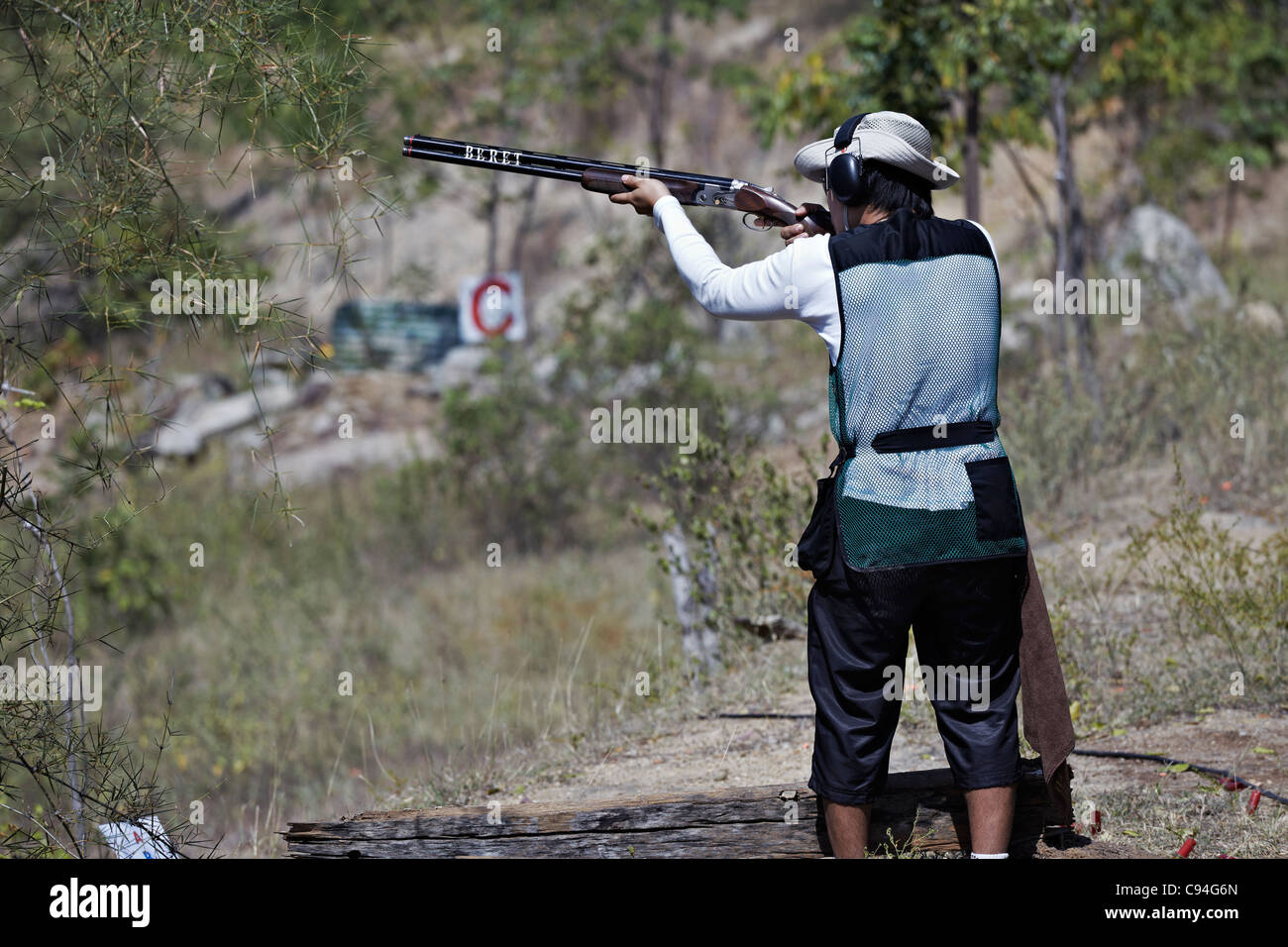 Clay pigeon shooting. Man using a shotgun and taking aim at a clay pigeon shoot Stock Photo Alamy