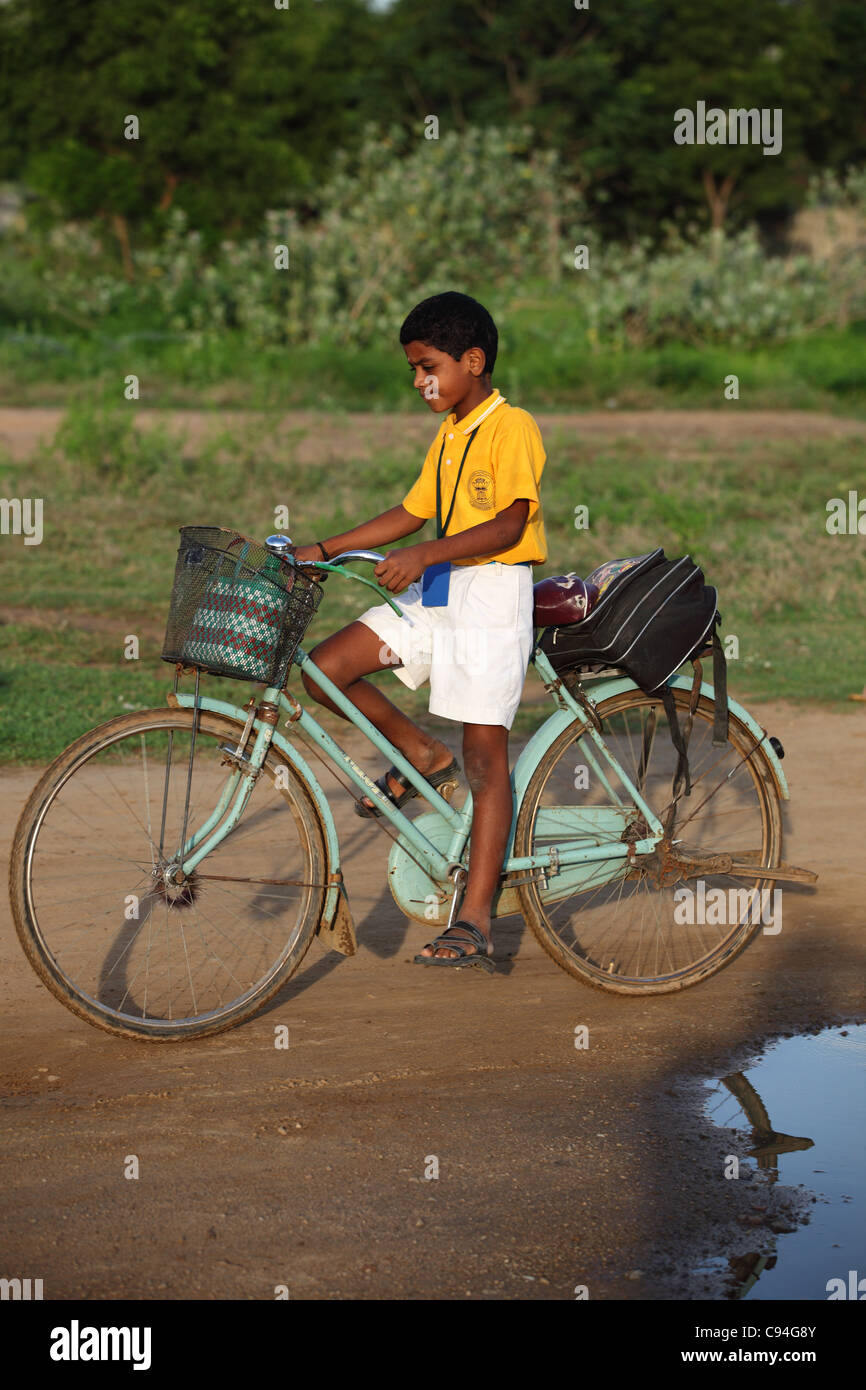 Indian school boy on bicycle Tamil Nadu India Stock Photo