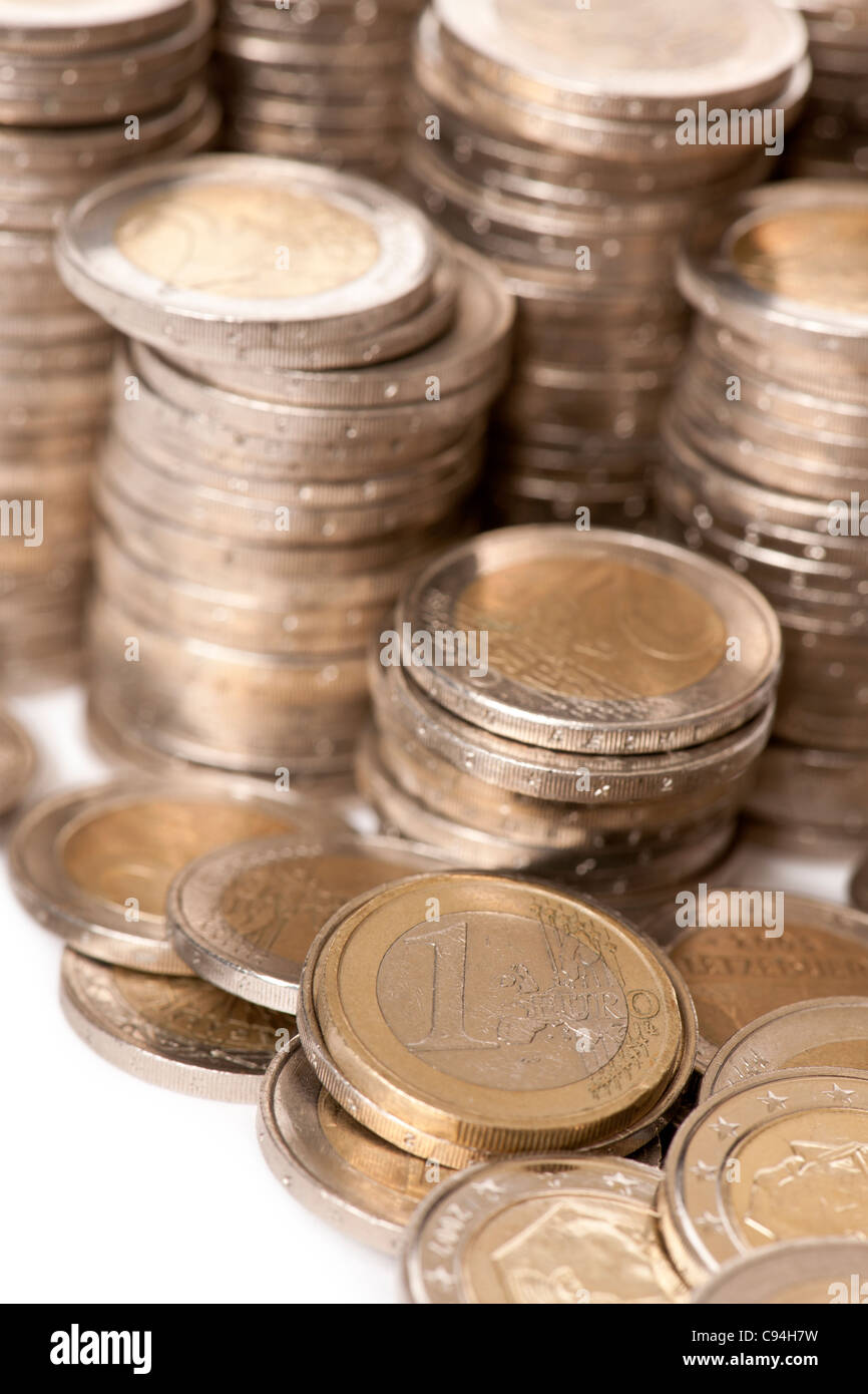 Close-up stacks of 2 Euros Coins in front of white background Stock Photo