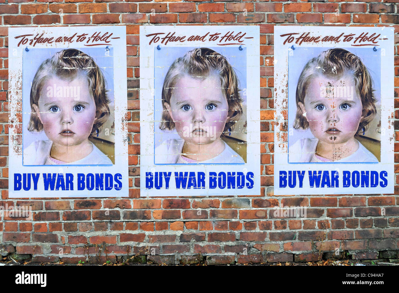 American WW2 Propaganda Posters on a brick wall Stock Photo