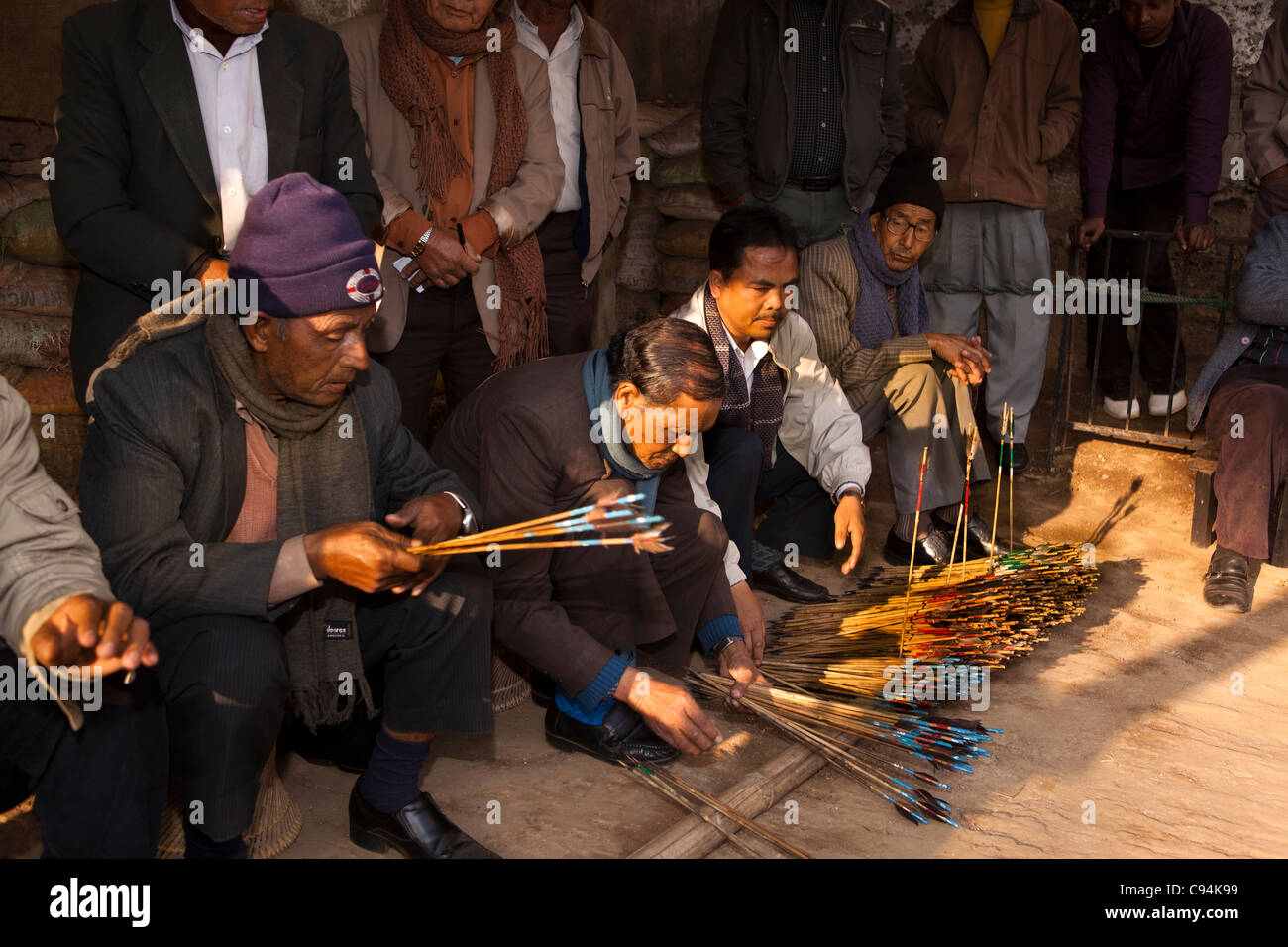 India, Meghalaya, Shillong, Bola archery gambling game, officials sorting and counting number of arrows Stock Photo