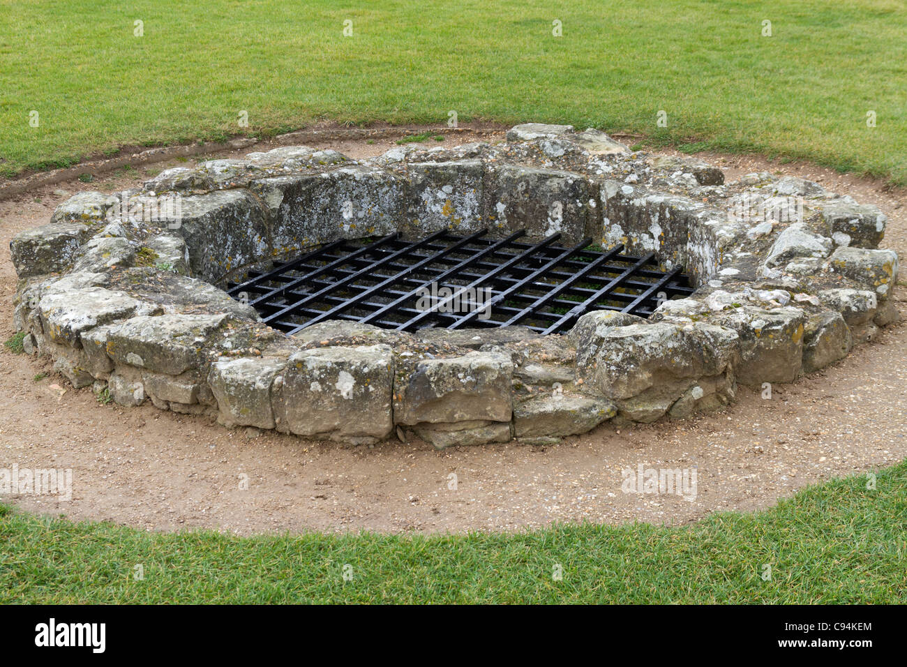 Water well in the grounds of Pevensey Castle Stock Photo