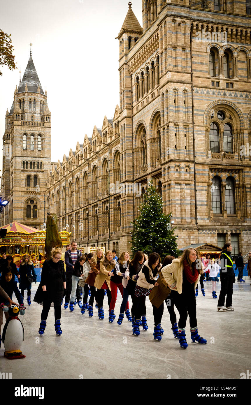 People ice skating by the Natural History Museum London England Great Britain UK Stock Photo