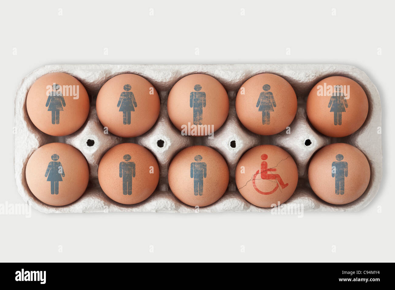 Box of eggs. Male and female symbols on nine of them and one cracked egg with a disabled symbol on it Stock Photo