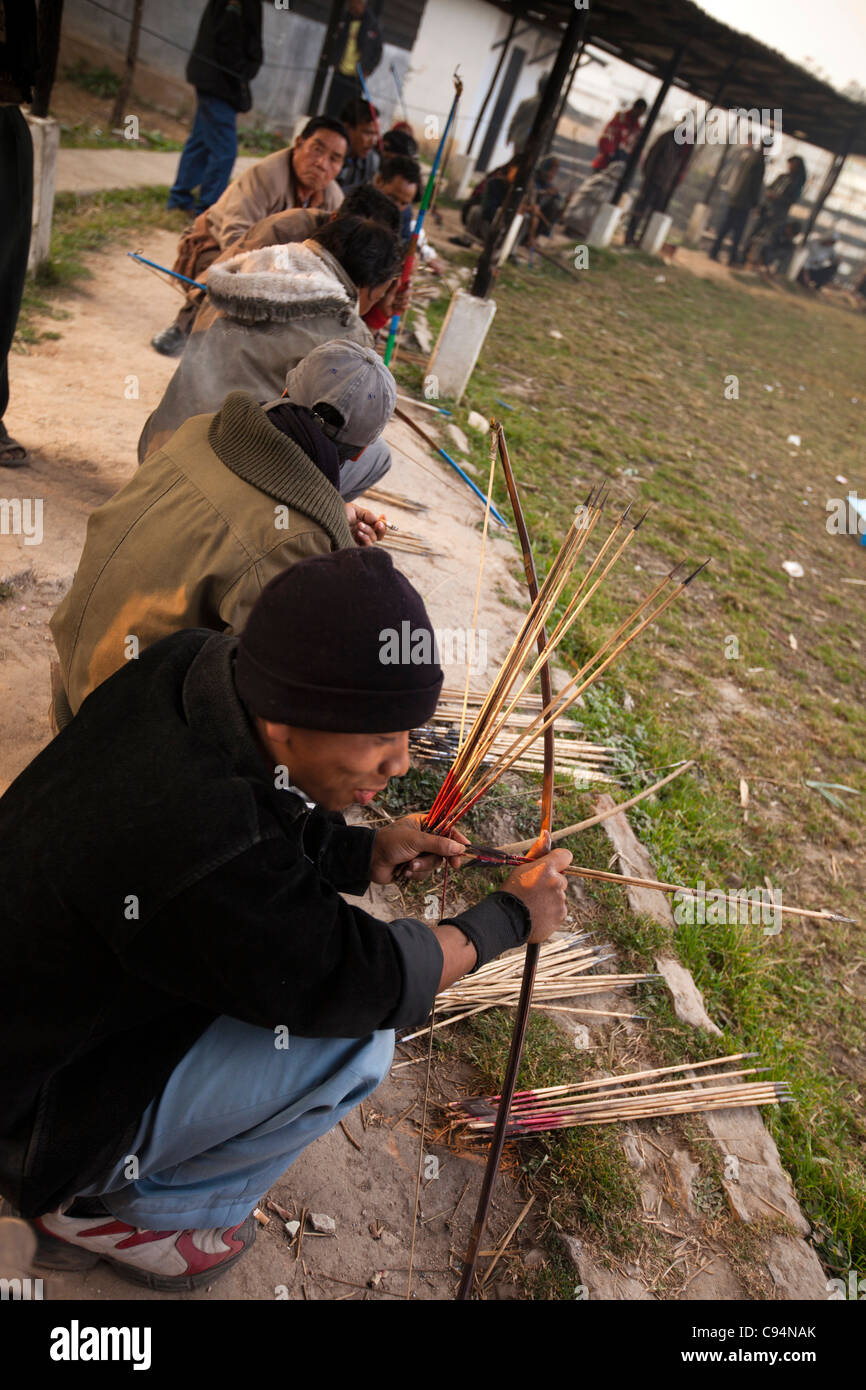 India, Meghalaya, Shillong, Bola archery gambling game, archers firing arrows at cylindrical target Stock Photo