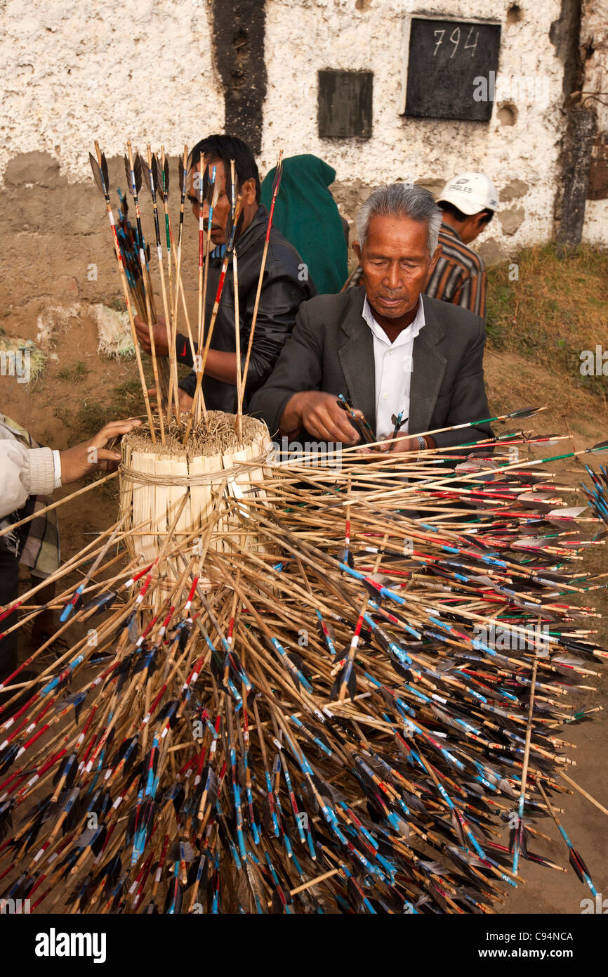 India, Meghalaya, Shillong, Bola archery gambling game, officials counting number of arrows in target Stock Photo
