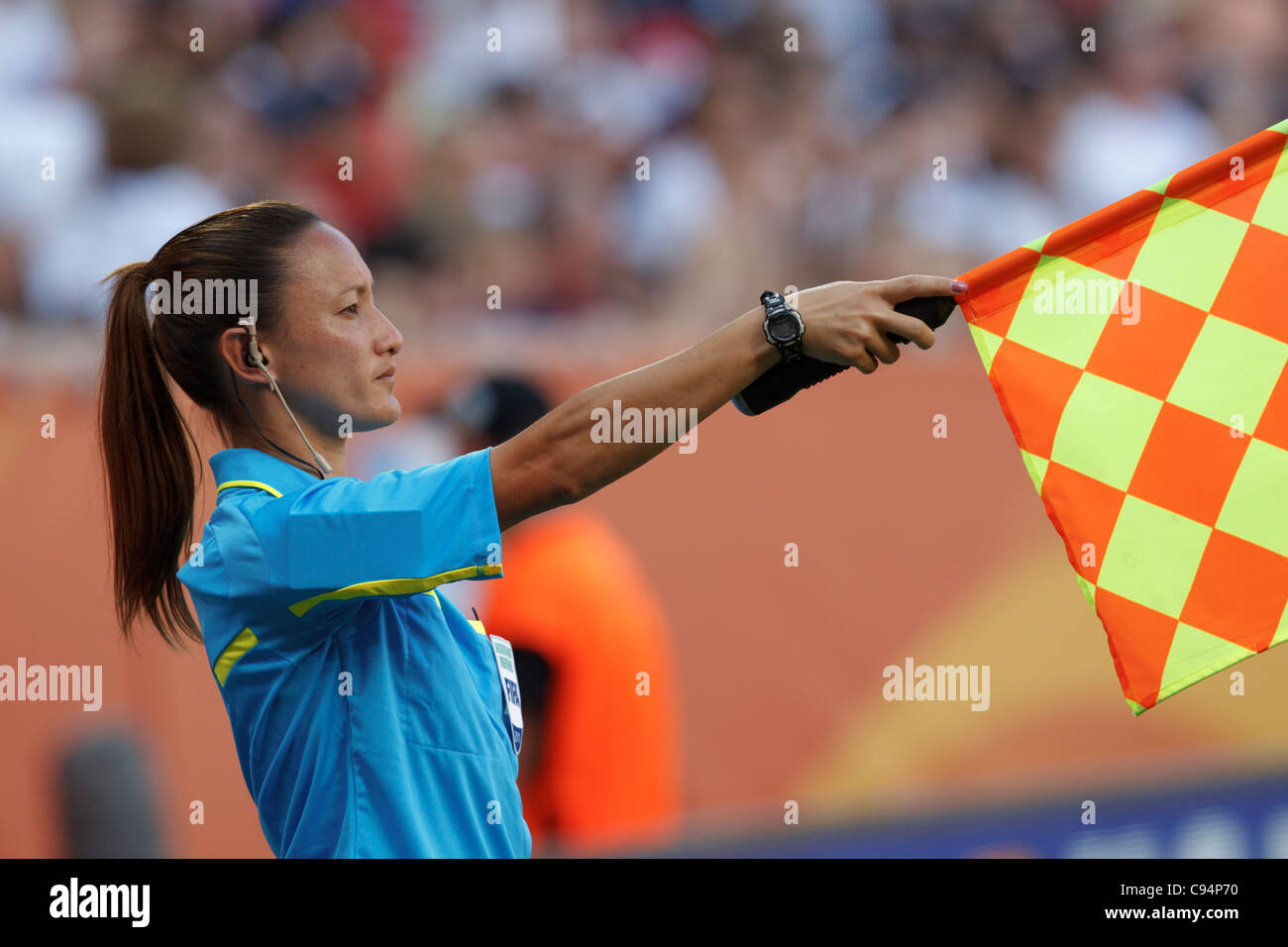 Assistant referee Sarah Ho raises her flag to signal offside during a Womens World Cup quarterfinal match between Brazil and USA Stock Photo