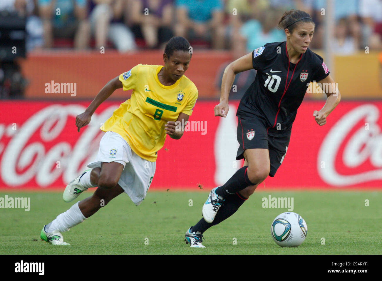 Carli Lloyd of the USA (R) moves the ball against Formiga of Brazil (L) during a 2011 FIFA Women's World Cup quarterfinal match. Stock Photo