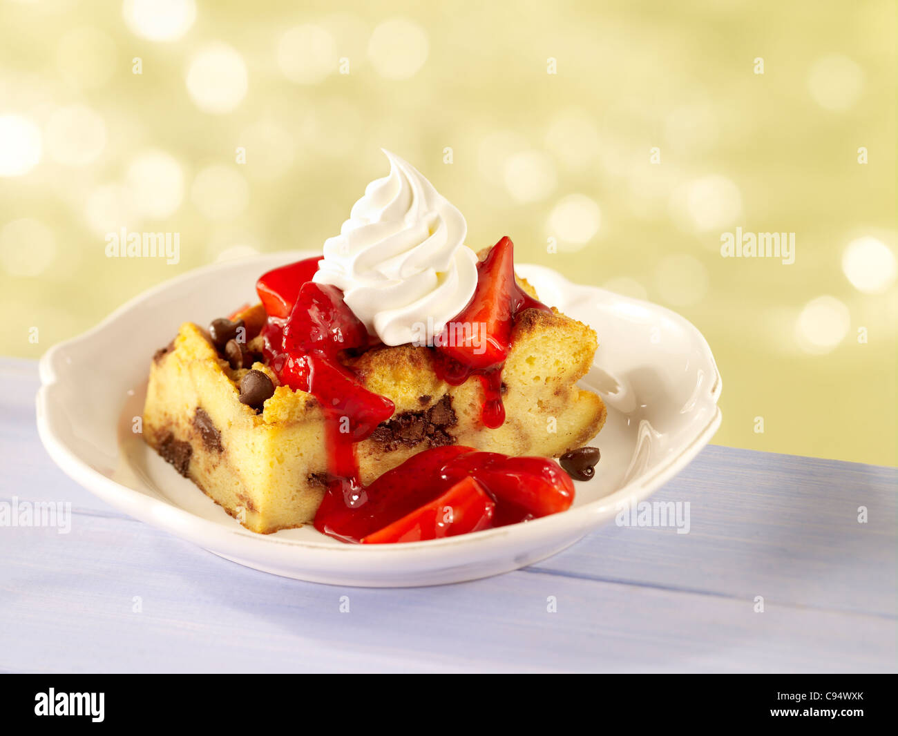 Strawberry bread pudding topped with whipped cream Stock Photo Alamy