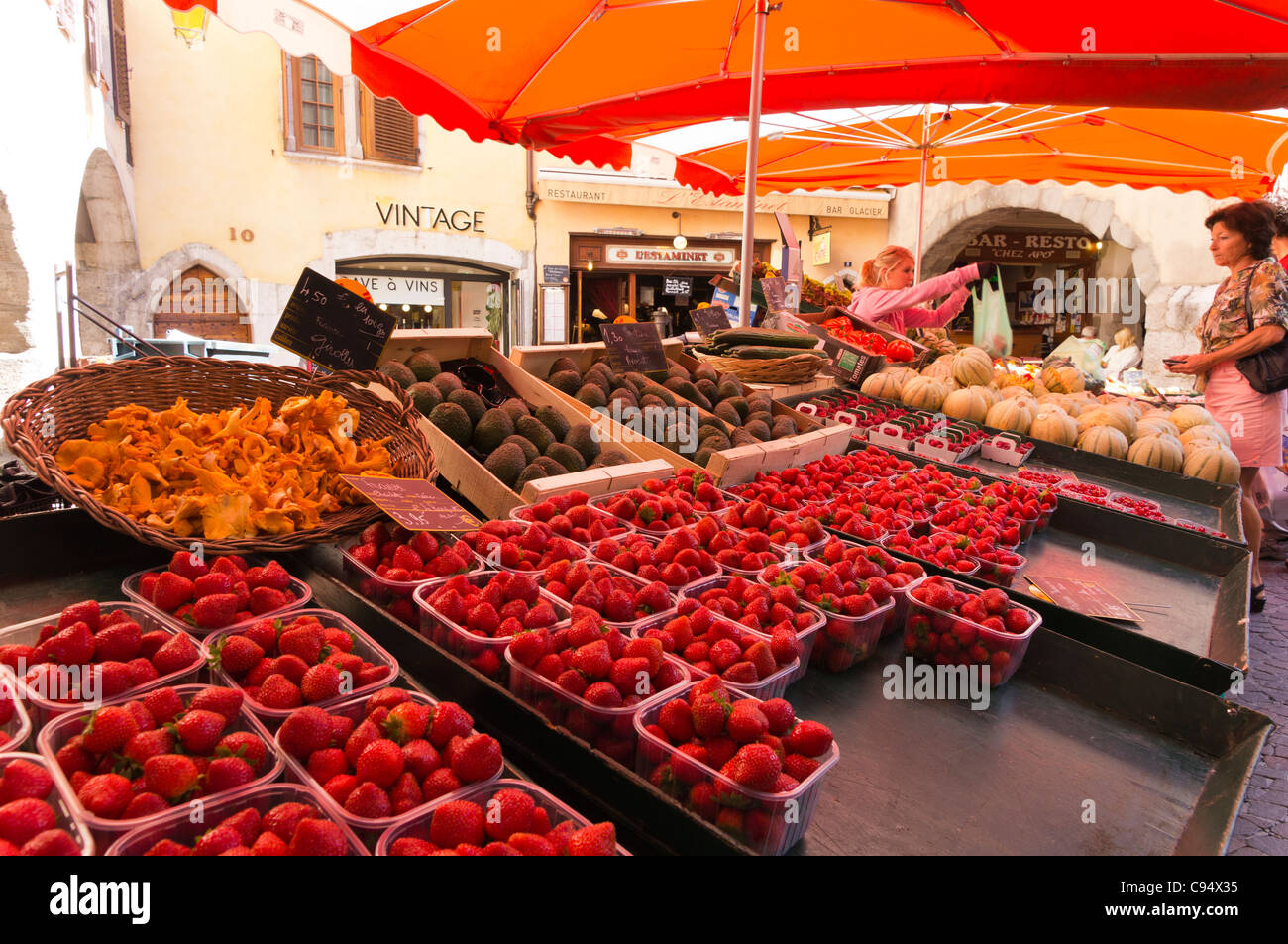 Market trader's stall in the centre of the old town of Annecy Stock