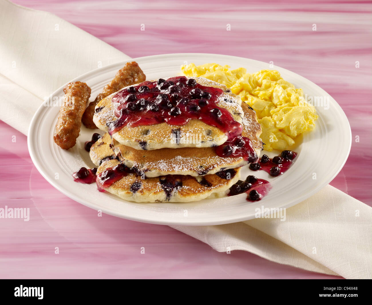 Blueberry pancakes with eggs and sausage Stock Photo Alamy