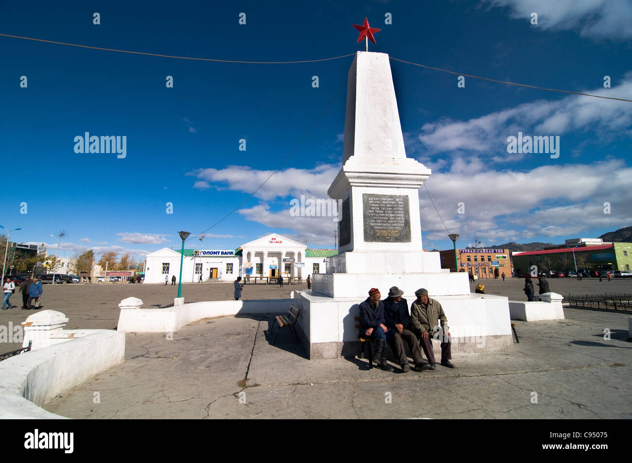 Elderly men sitting in the main sq. of Bayan-Ölgii in western Mongolia. Stock Photo