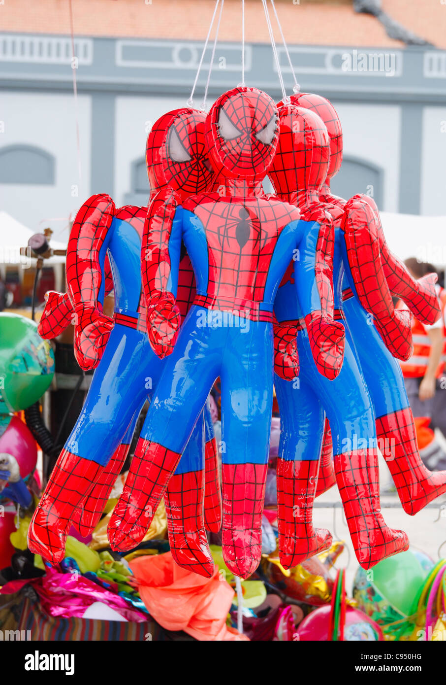 Inflatable Spiderman dolls on market stall in Spain Stock Photo