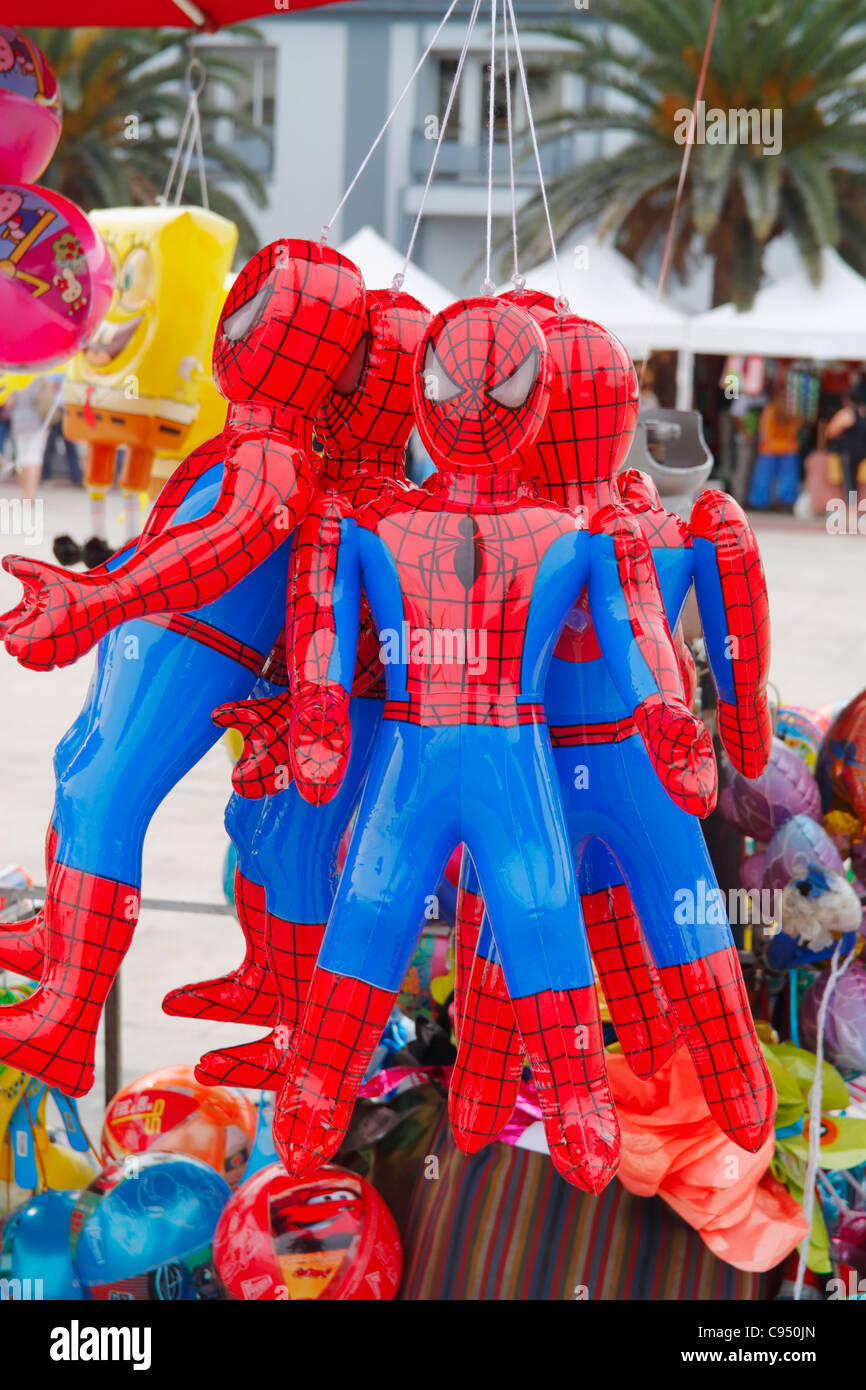 Inflatable Spiderman dolls on market stall in Spain Stock Photo