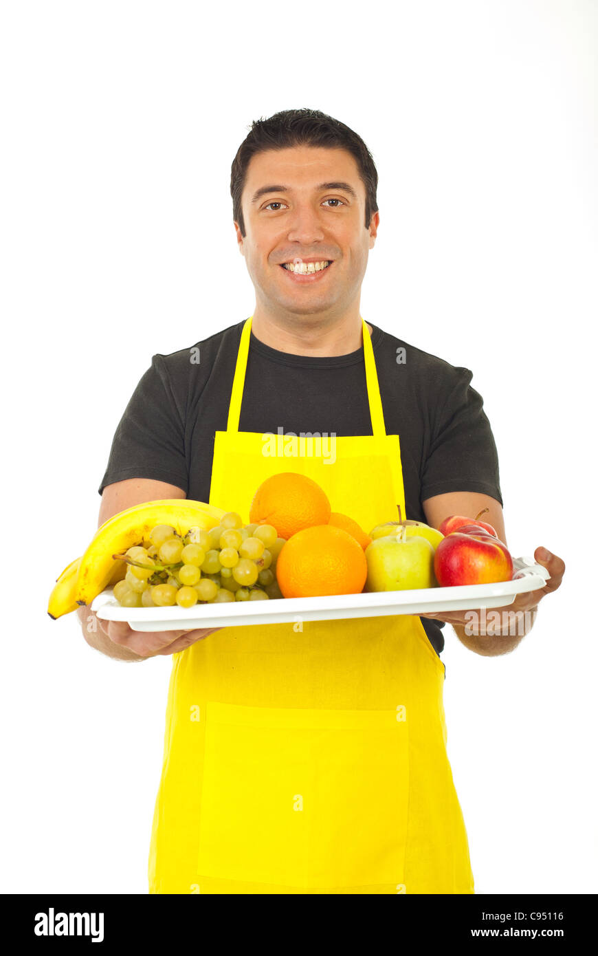 Happy fruiterer offering fresh fruits isolated on white background Stock Photo