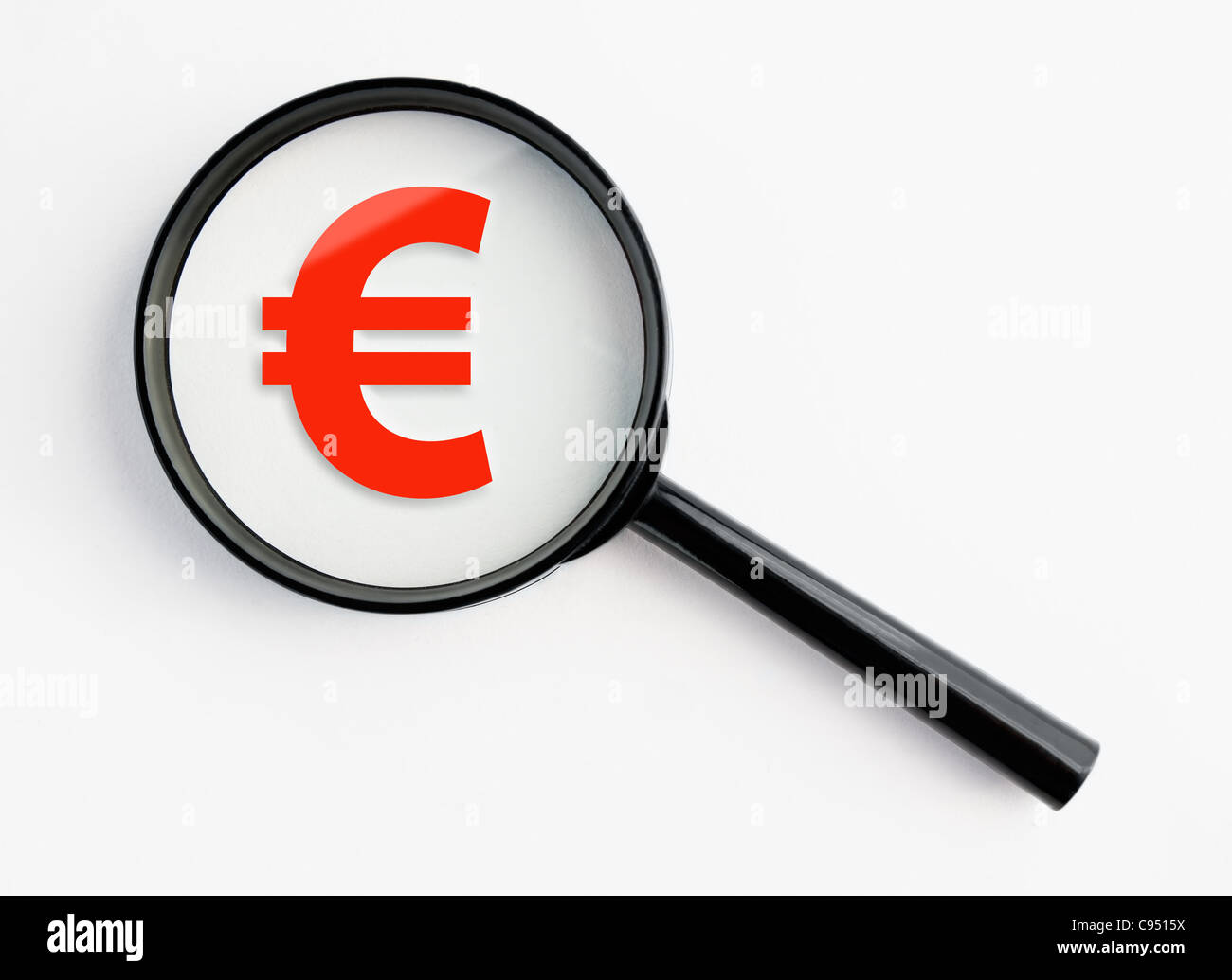 euro symbol under a magnifying glass, with isolated background Stock Photo