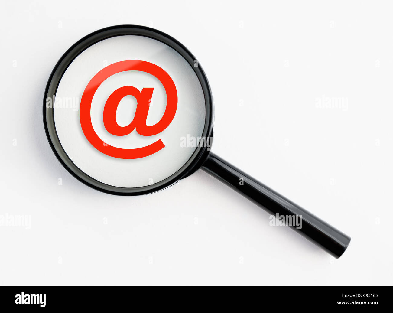 @-symbol under a magnifying glass, with isolated background Stock Photo