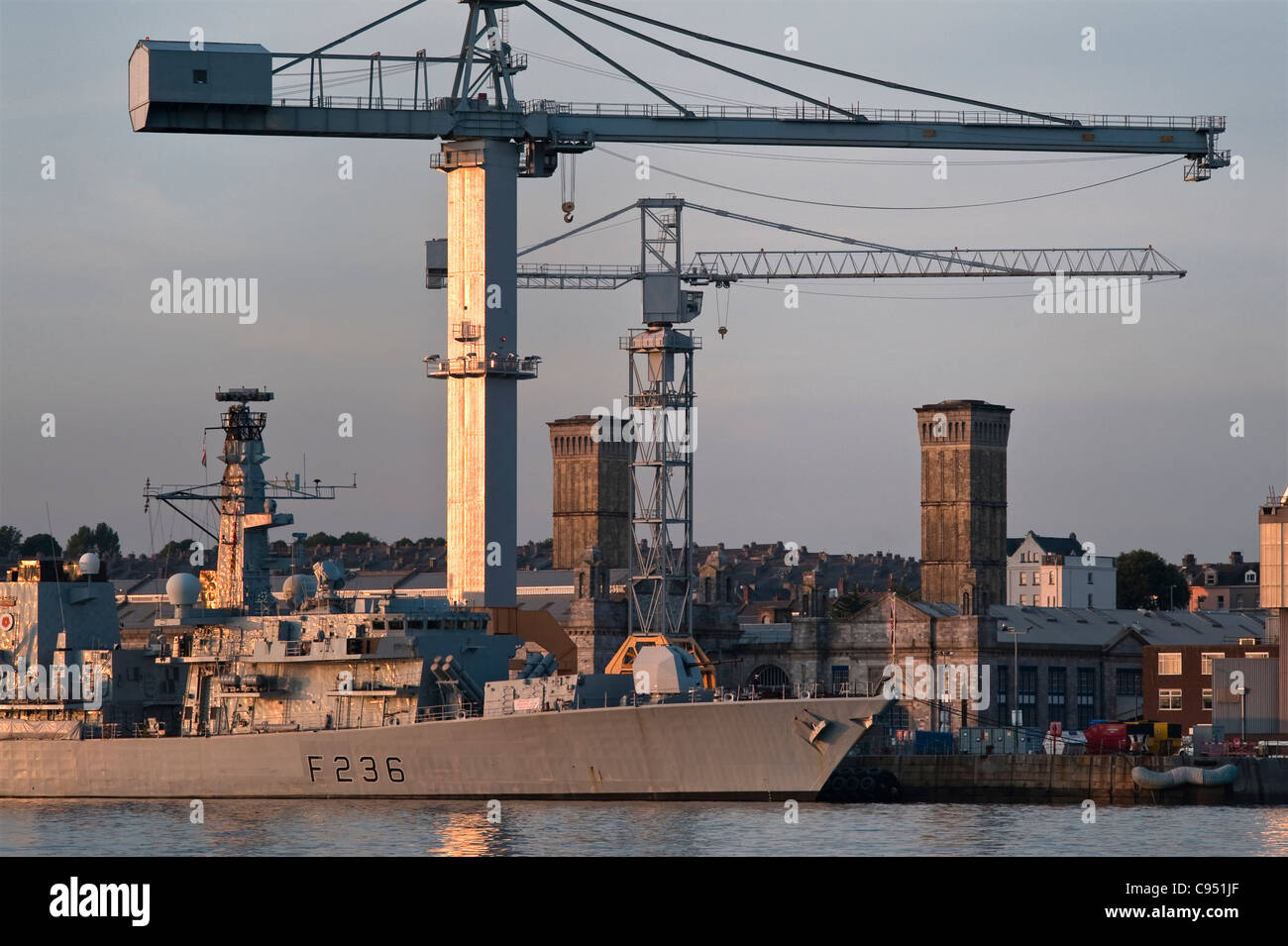 The Devonport Royal Dockyard, Plymouth, Devon, UK with HMS Montrose, a Type 23 frigate of the Royal Navy Stock Photo