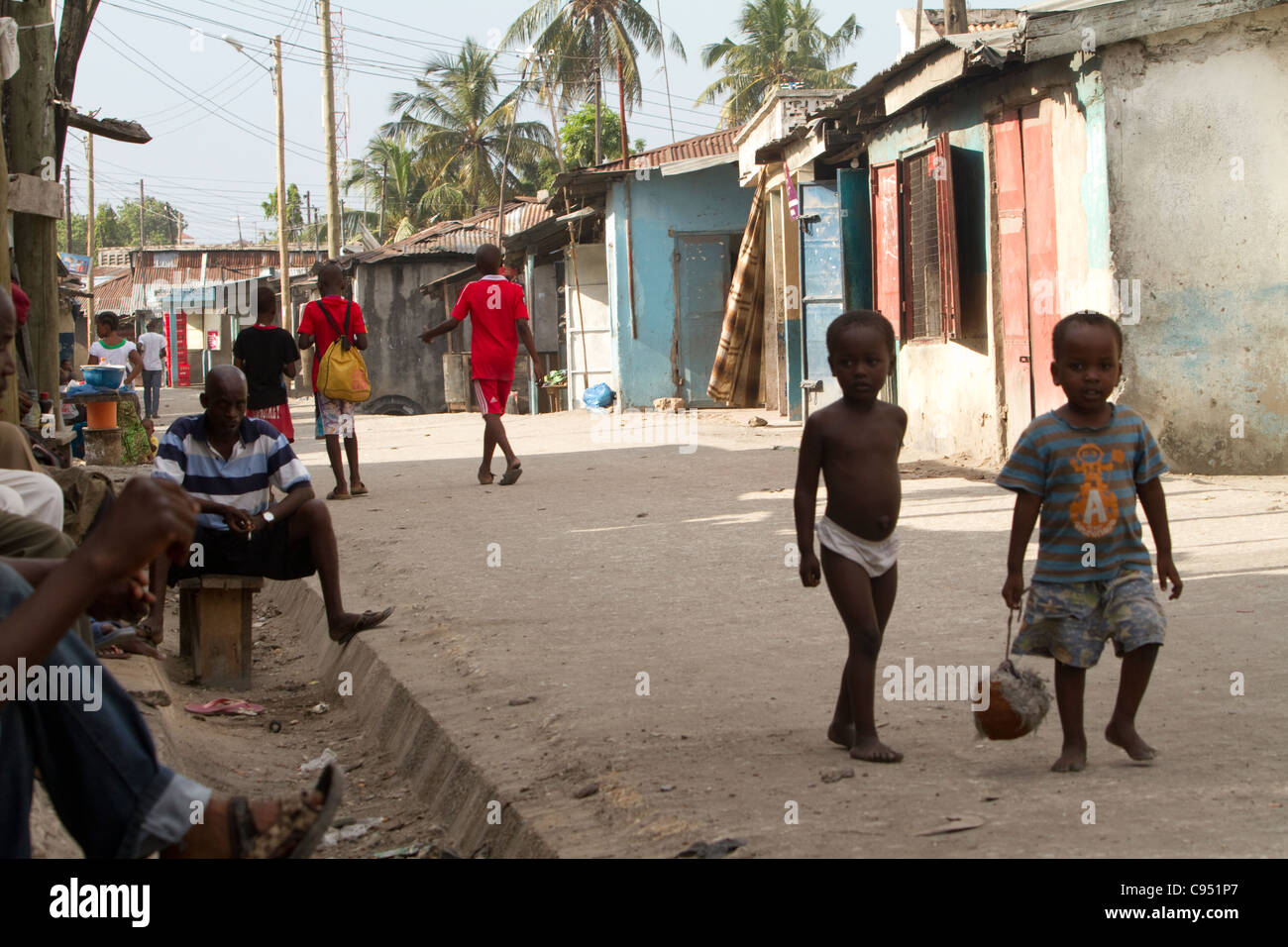 Children walk through the streets of Keko, a slum in Dar es Salaam, Tanzania, East Africa Stock