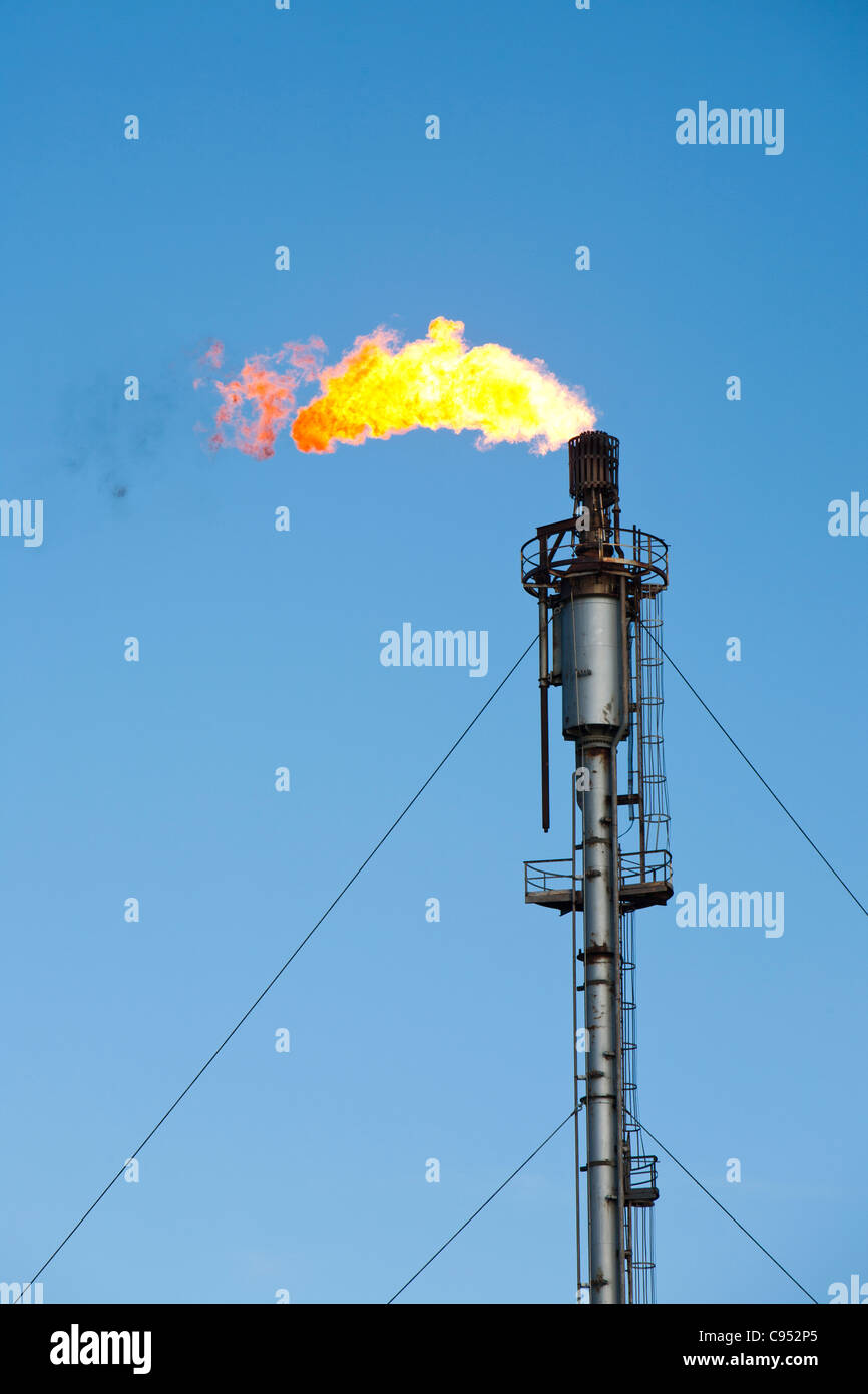 Flaring of waste gas at Flotta oil terminal in the Orkney's Scotland, UK. Stock Photo