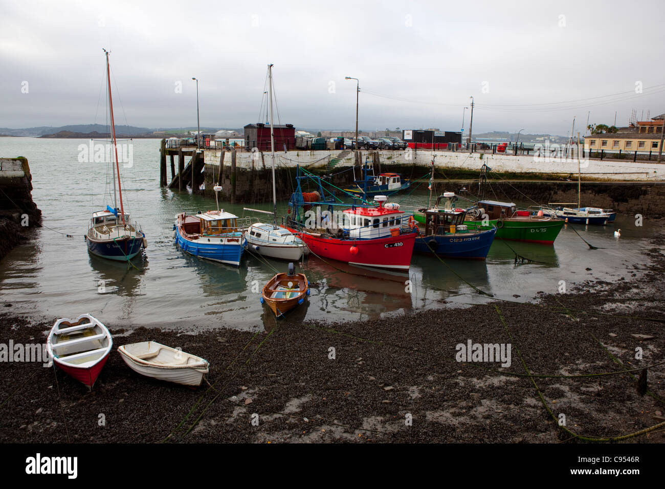 Fishing boats at low tide in the old port town of Cobh, Cork, Ireland