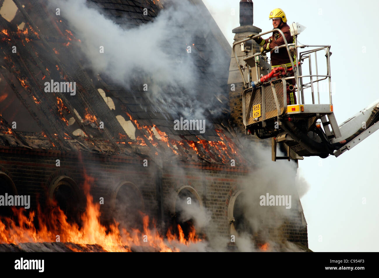 Firemen tackle a fire at an East London Church. Stock Photo