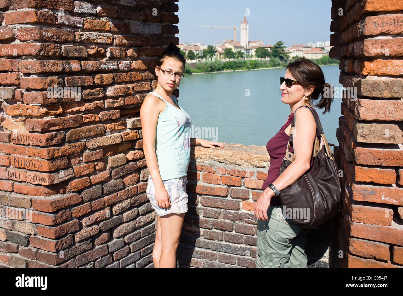 Mother and daughter on Ponte Scaligero, Verona, Italy. Stock Photo