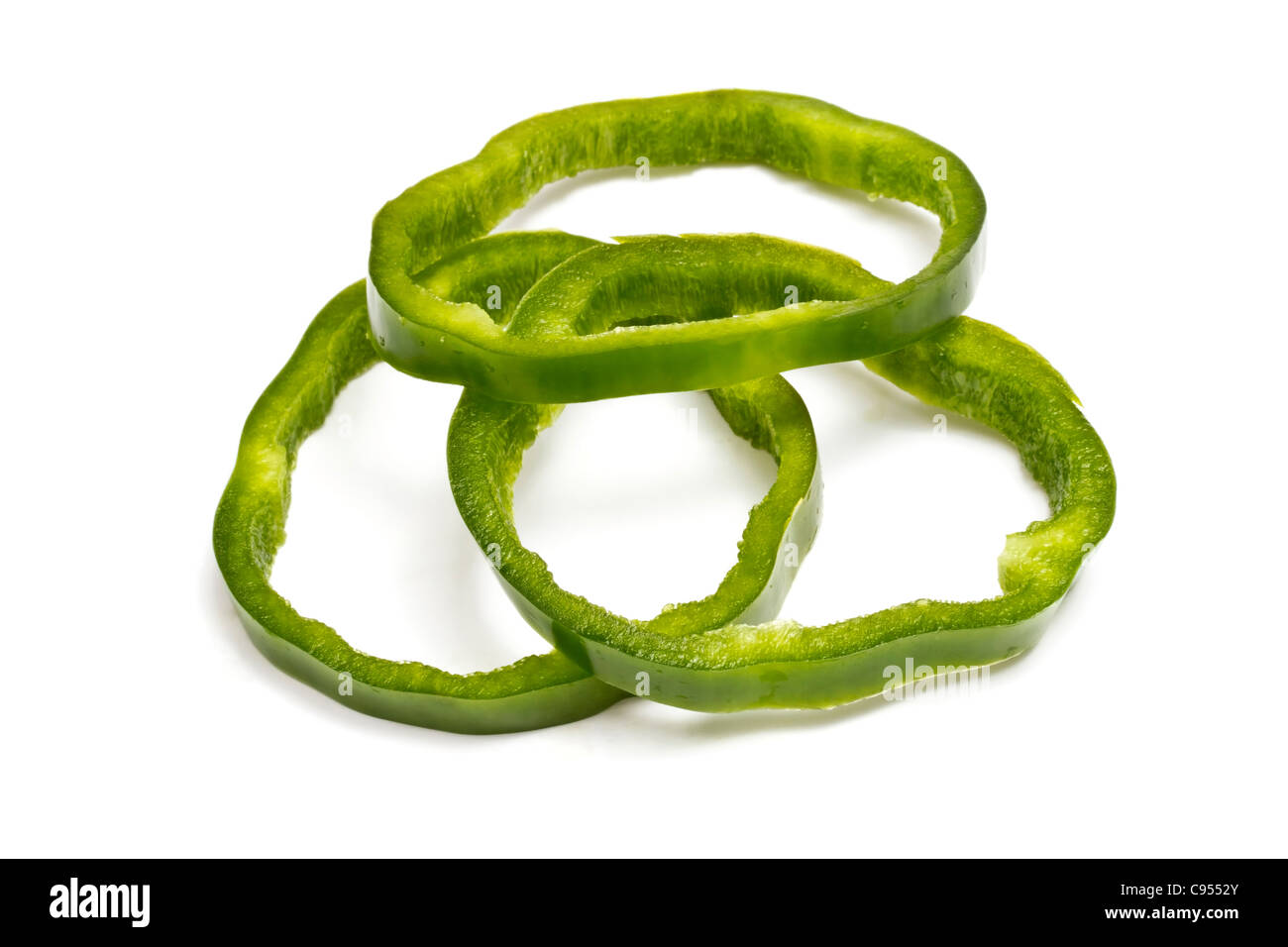 Sliced green pepper on white background Stock Photo - Alamy