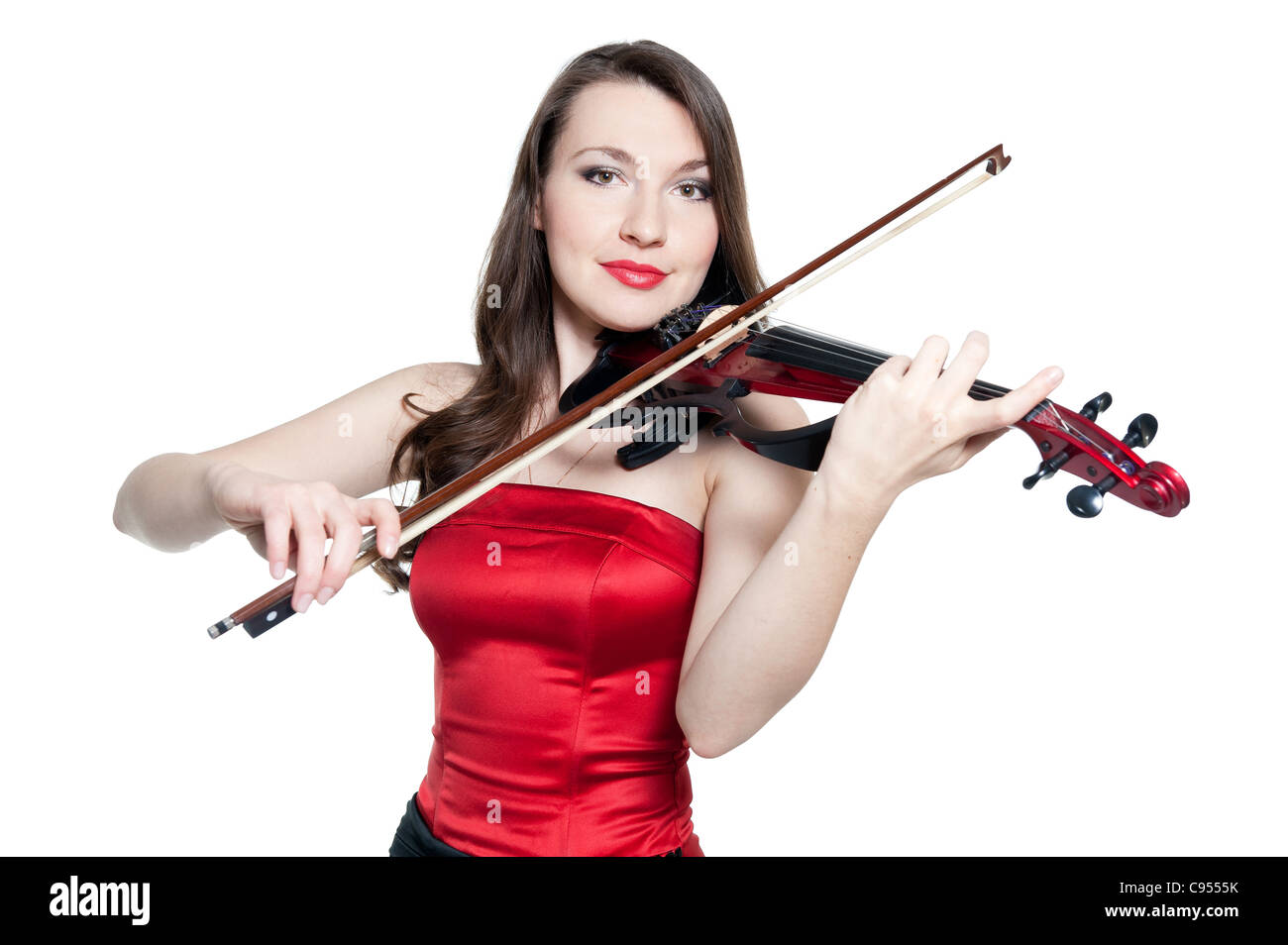 Violinist girl in red dress isolated on white background Stock Photo