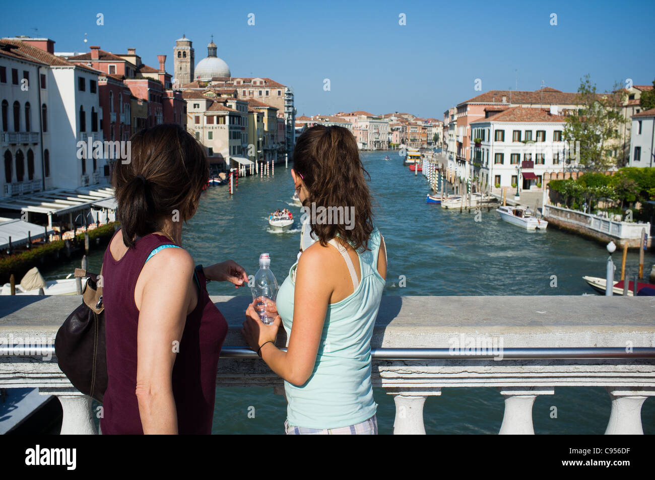 Mother and daughter view the Grand Canal in Venice Italy. Stock Photo