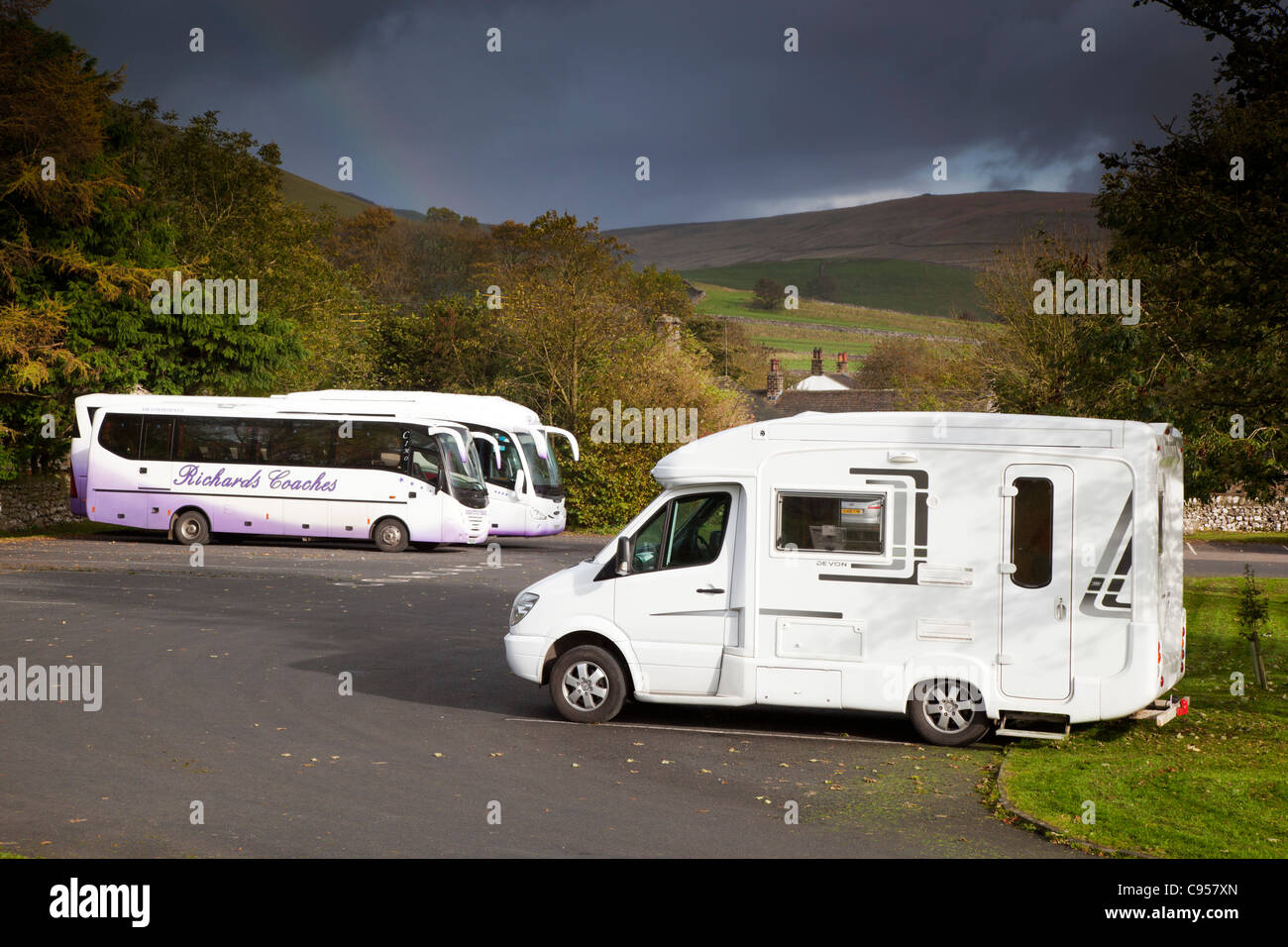Camper van and coaches parked at Malham; Yorkshire; UK Stock Photo