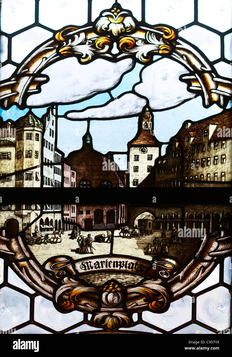 A window of stained glass from the New City Hall with an illustration of the Mary's Square in Munich, Germany. Stock Photo