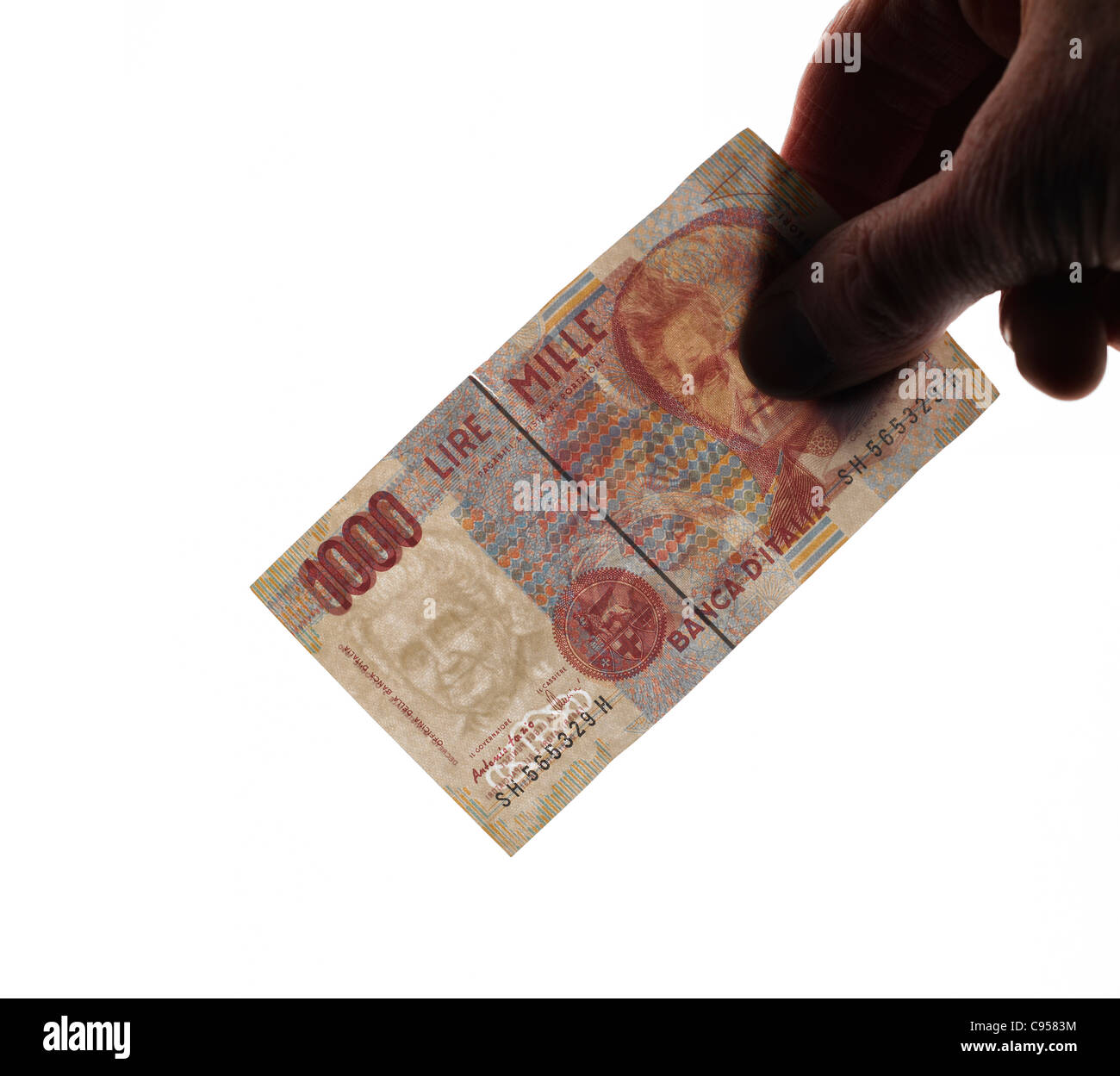 Hand holding old Italian 1000 Lire banknote Stock Photo