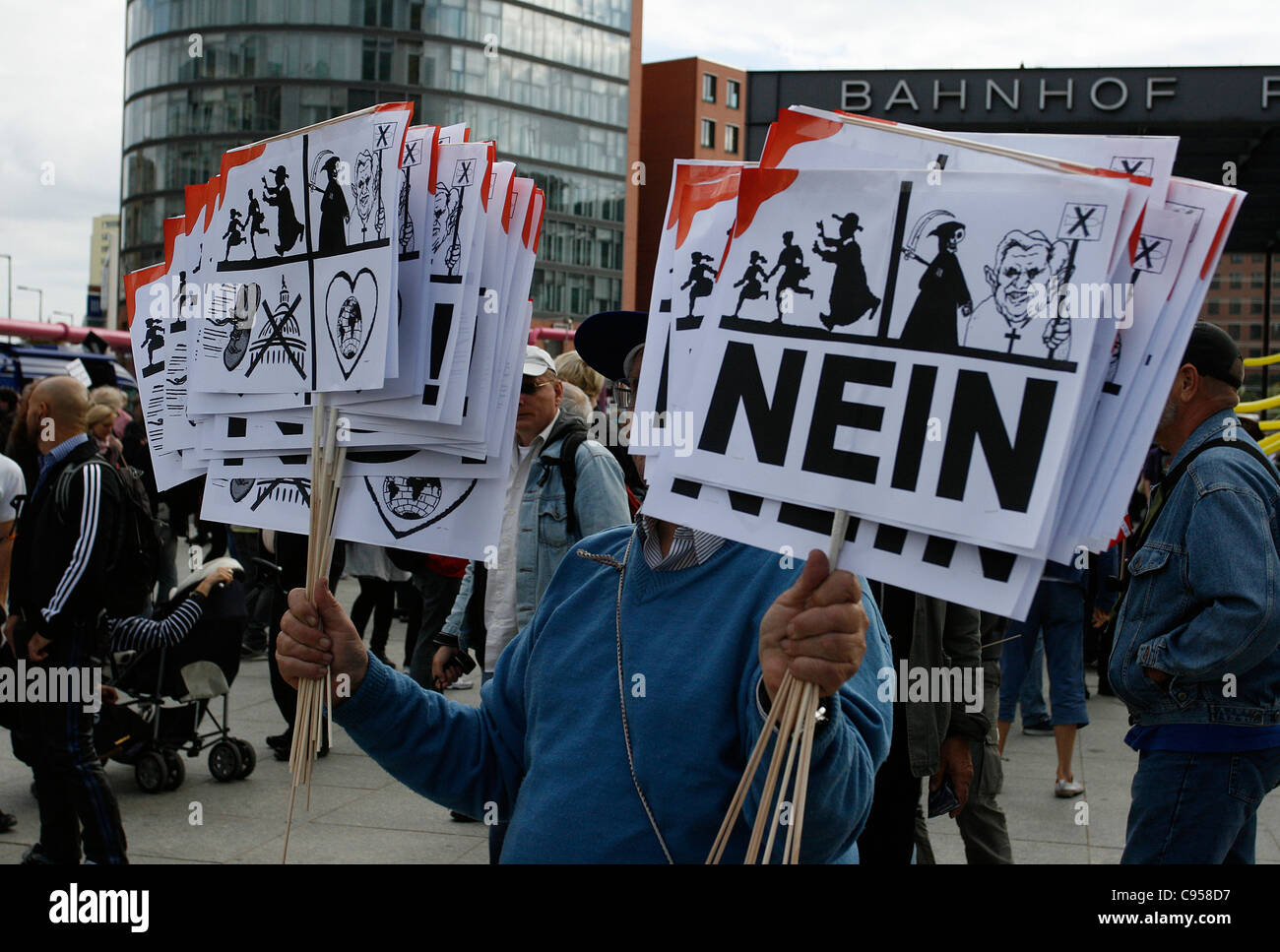 A participant of the protest against the pope visit in Germany and his politics denunciates sexual abuse in the catholic church. Stock Photo