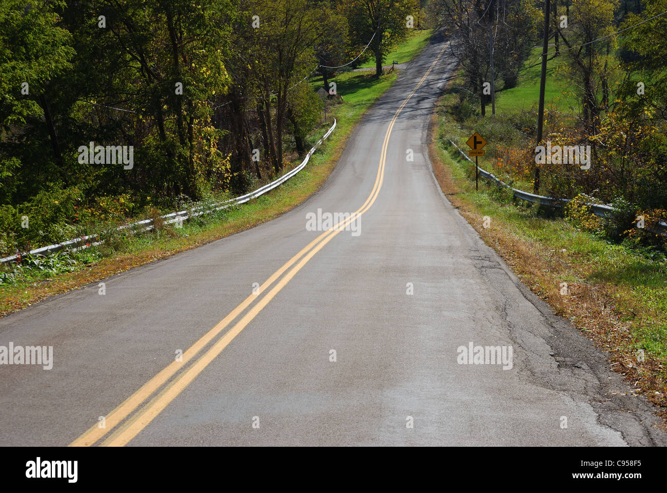 Rural upstate New York Road dips down and up Stock Photo Alamy