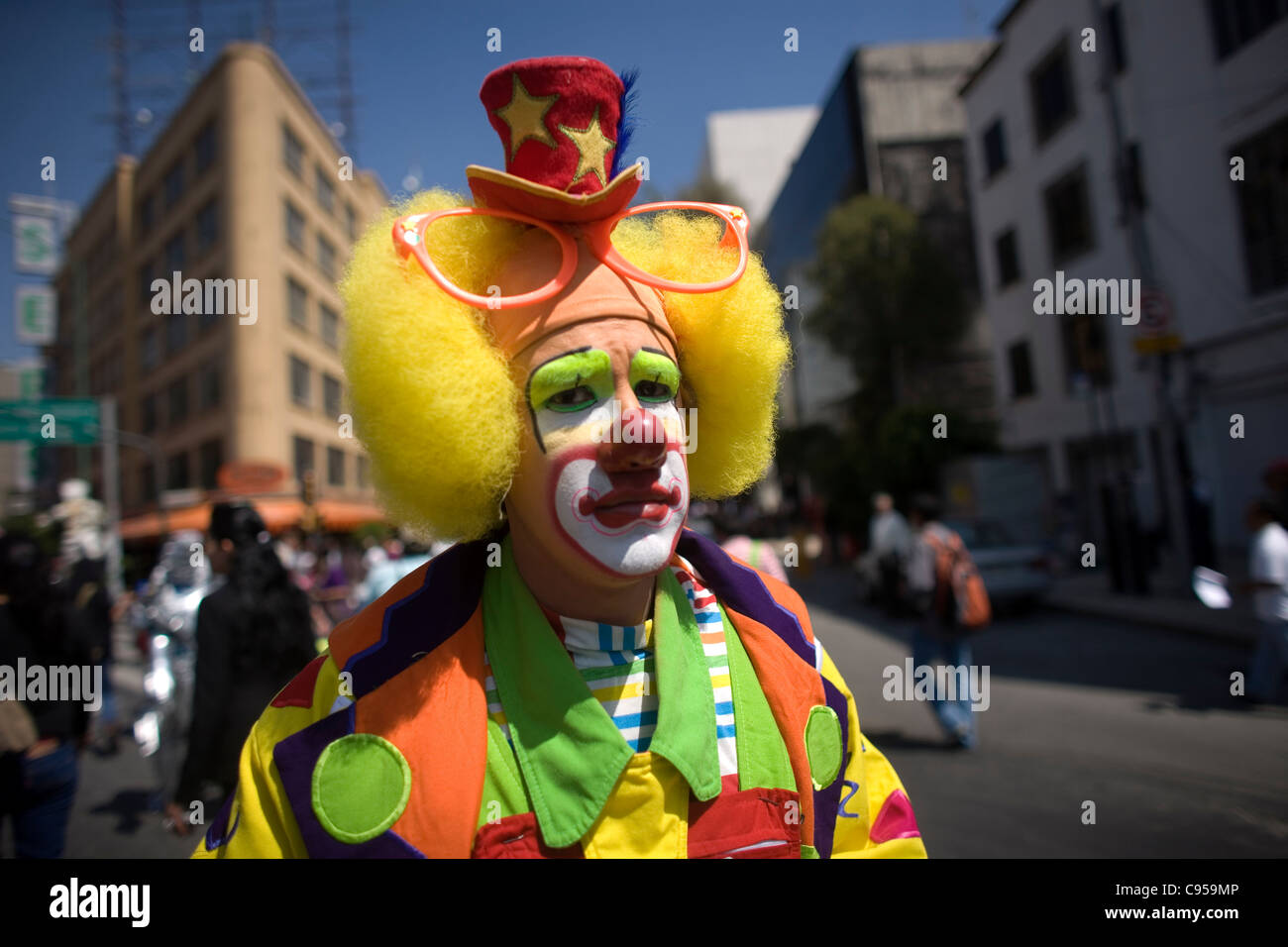 A clown walks in a parade during the International Clown Convention organized by the Latino Clown Brotherhood in Mexico City Stock Photo