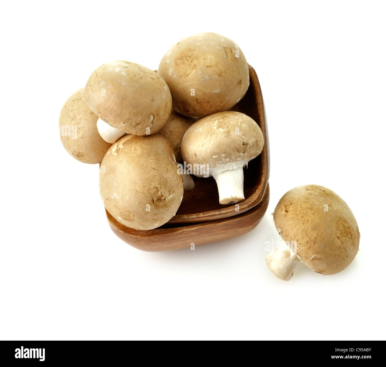 Brown Champignons In A Wooden Bowl , Close Up Stock Photo