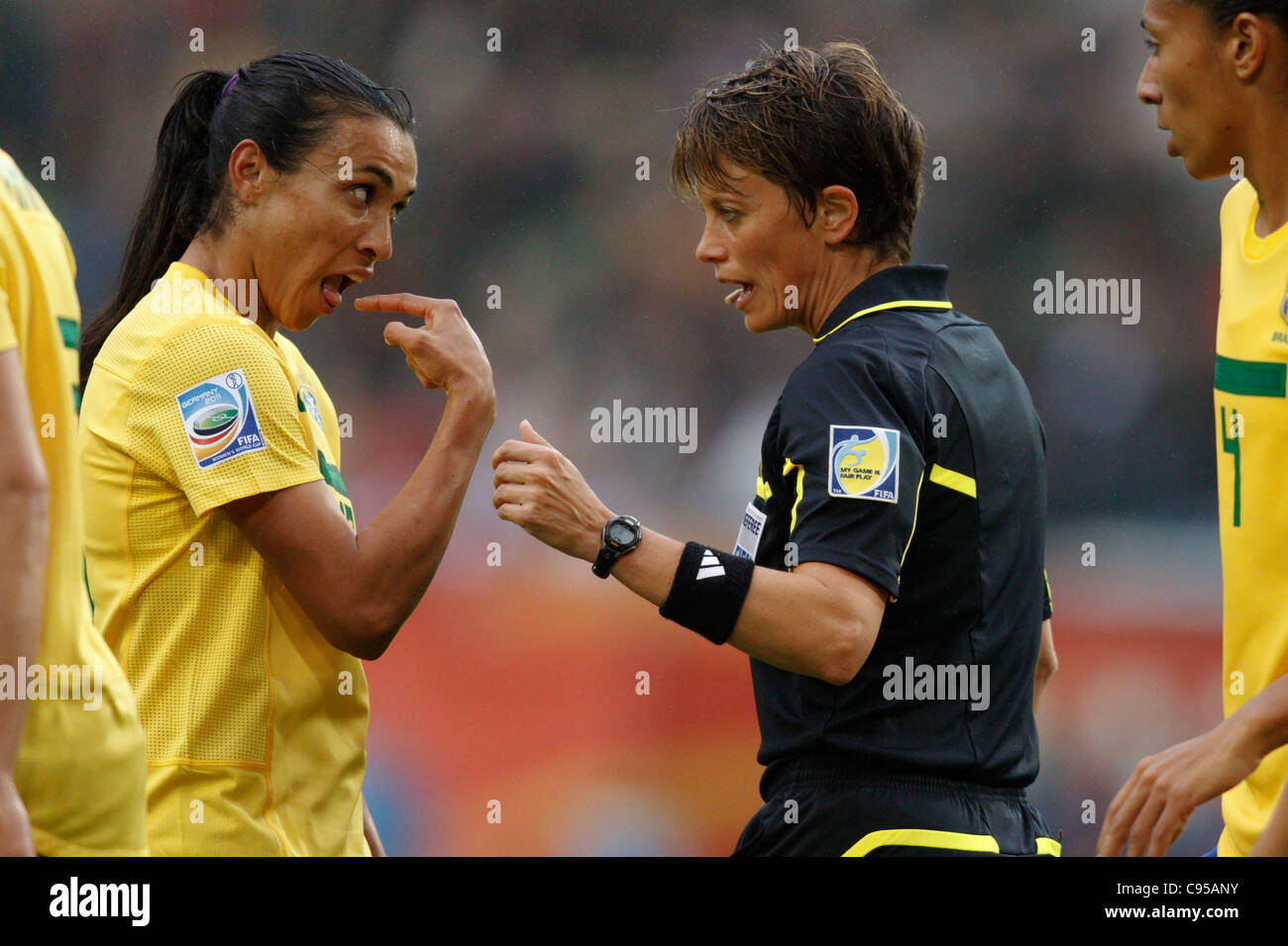 Marta of Brazil (L) gestures to referee Kari Seitz (R) after a contentious play in a 2011 FIFA Women's World Cup Group D match. Stock Photo