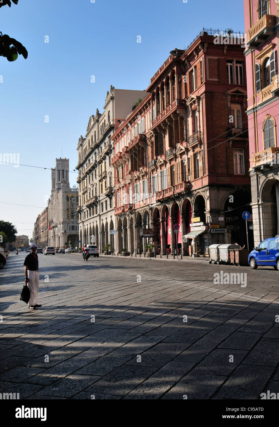 Man about to cross the via Roma road in Cagliari, Sardinia Stock Photo