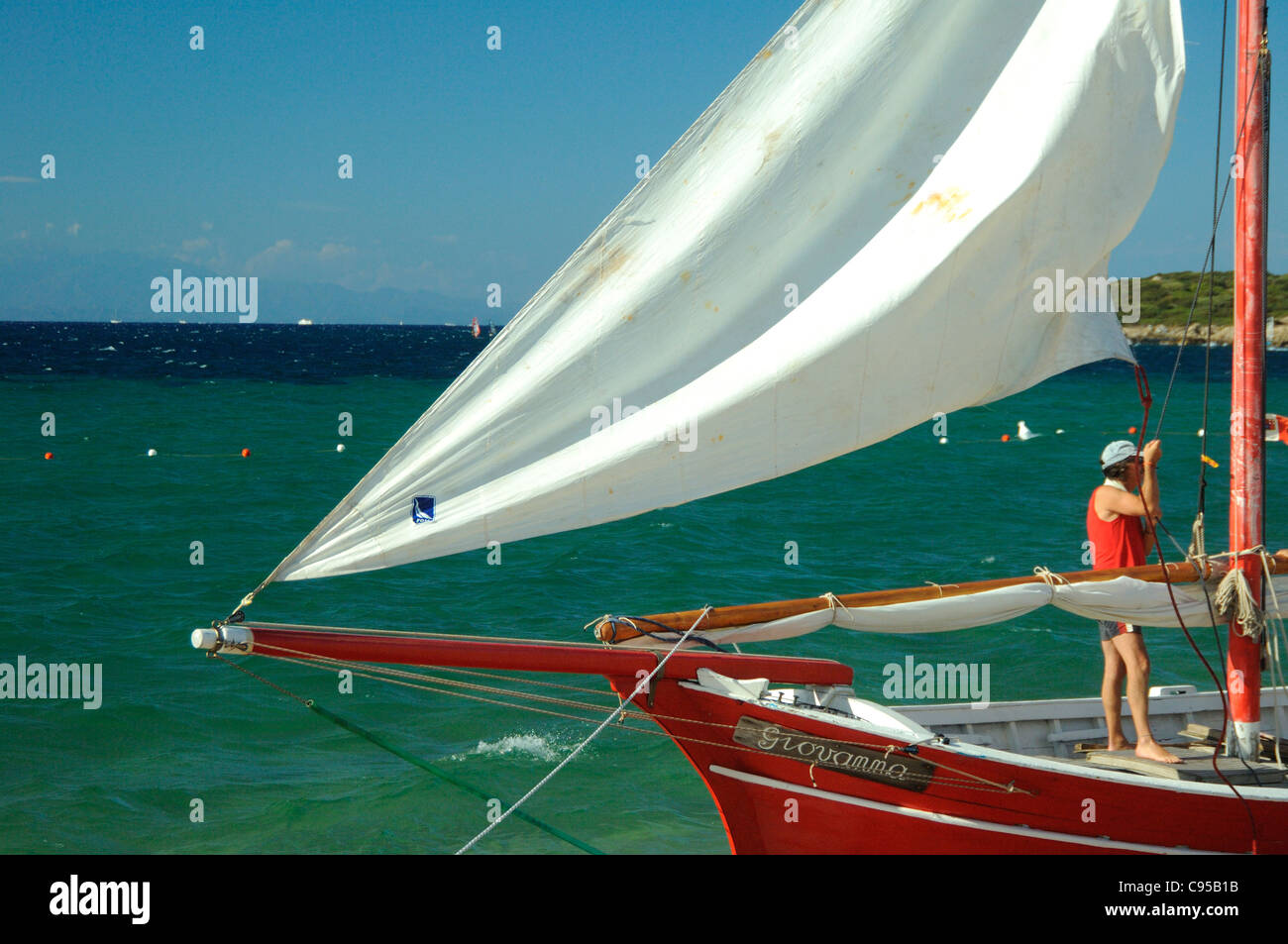 Spinnaker sail of a Latin boat bows,landing at Porto Pollo beach,Palau,Sardinia Stock Photo