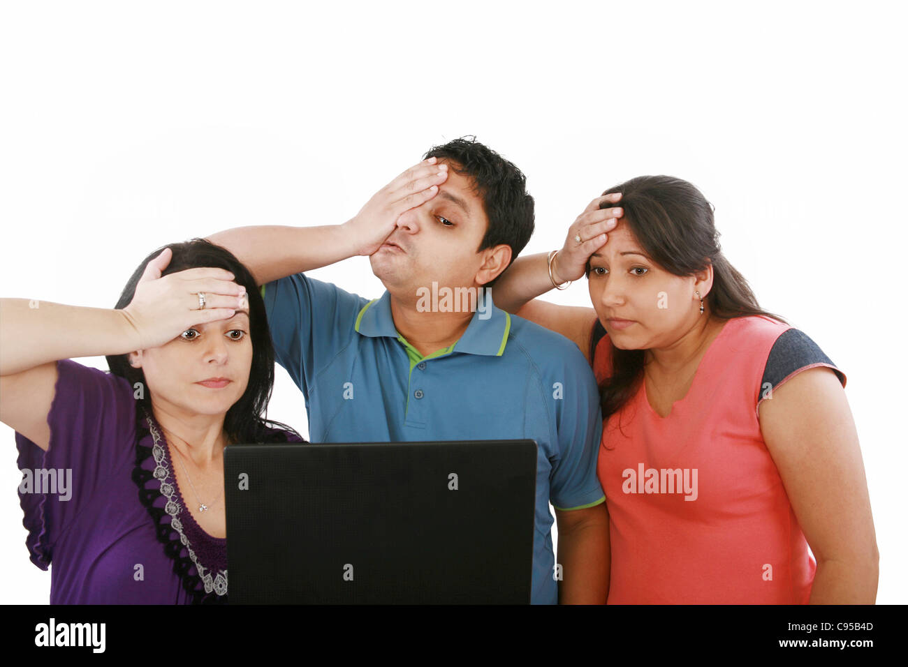domestic life: group of friends having problems with computers Stock Photo
