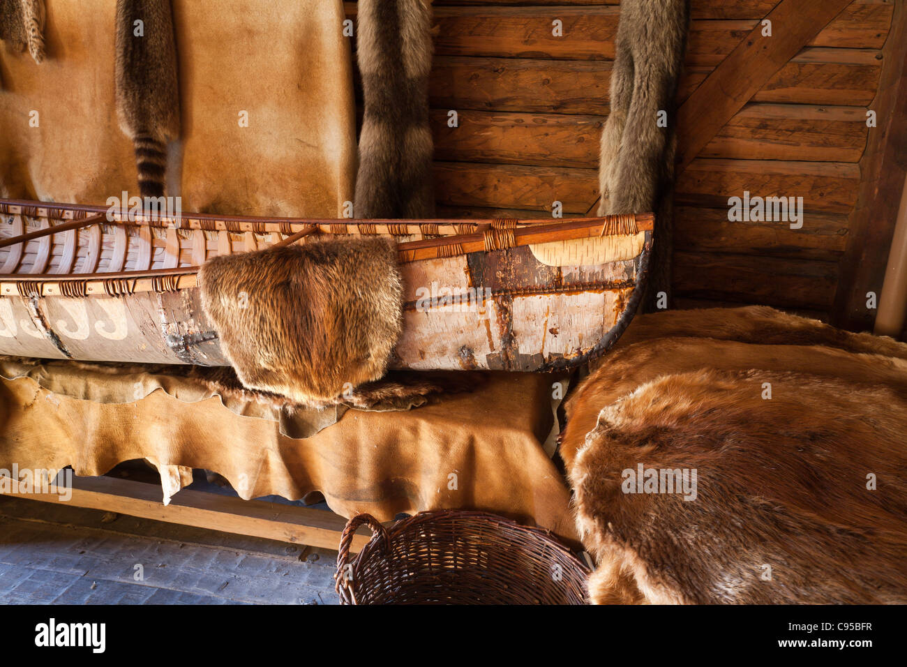 Canoe and Furs in a storage room at the Port Royal Habitation. The reconstructed Port Royal Habitation built in the early 1600s Stock Photo