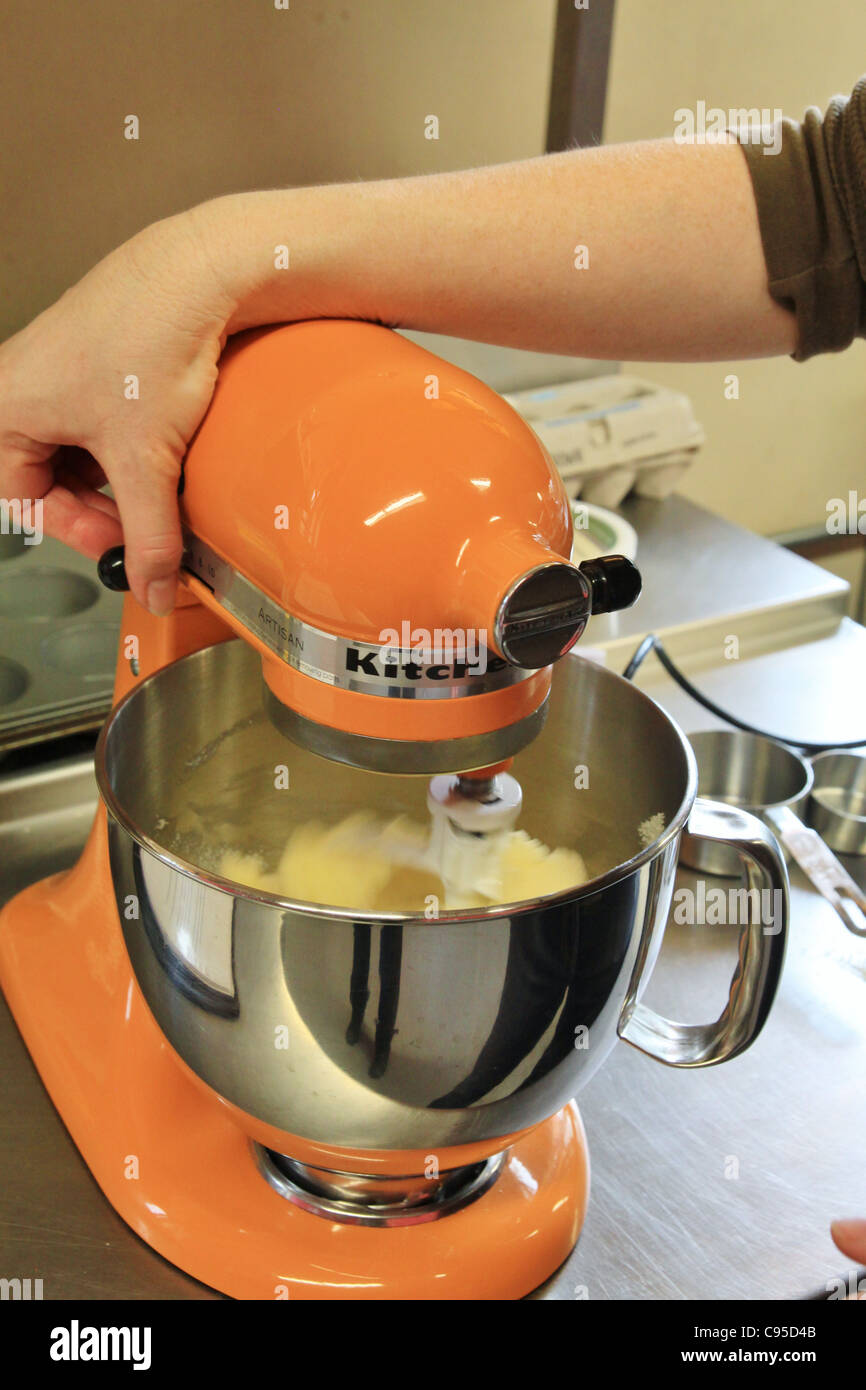 A person beating cake batter in a mixer Stock Photo Alamy