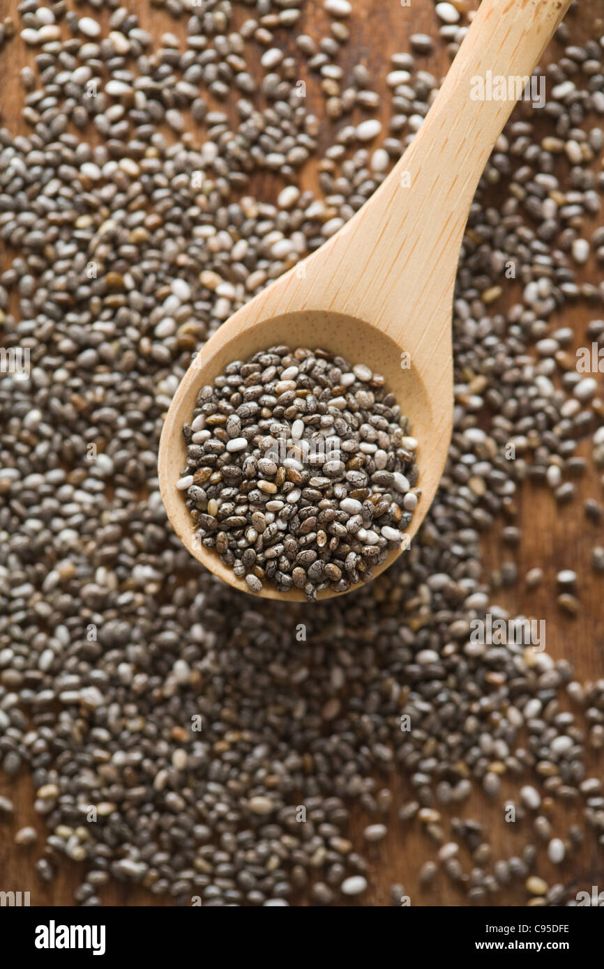 Spoon with whole Chia seeds Stock Photo