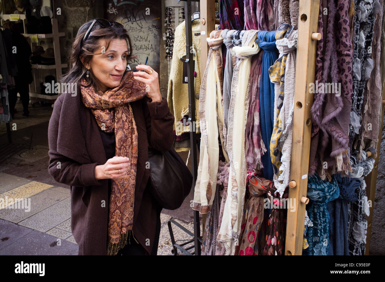 Scarf shopping woman. Annecy, France. 20/09/2011. Stock Photo