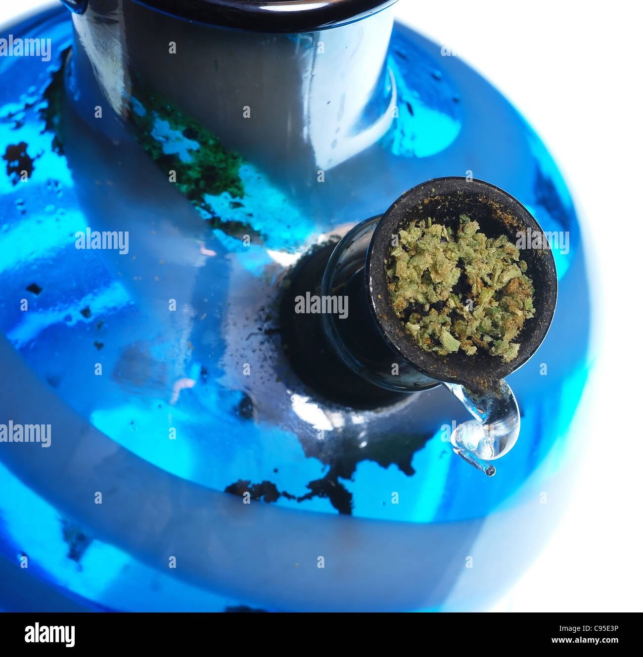 Glass pipe or bong for marijuana smoking on a blue fabric background Stock  Photo - Alamy