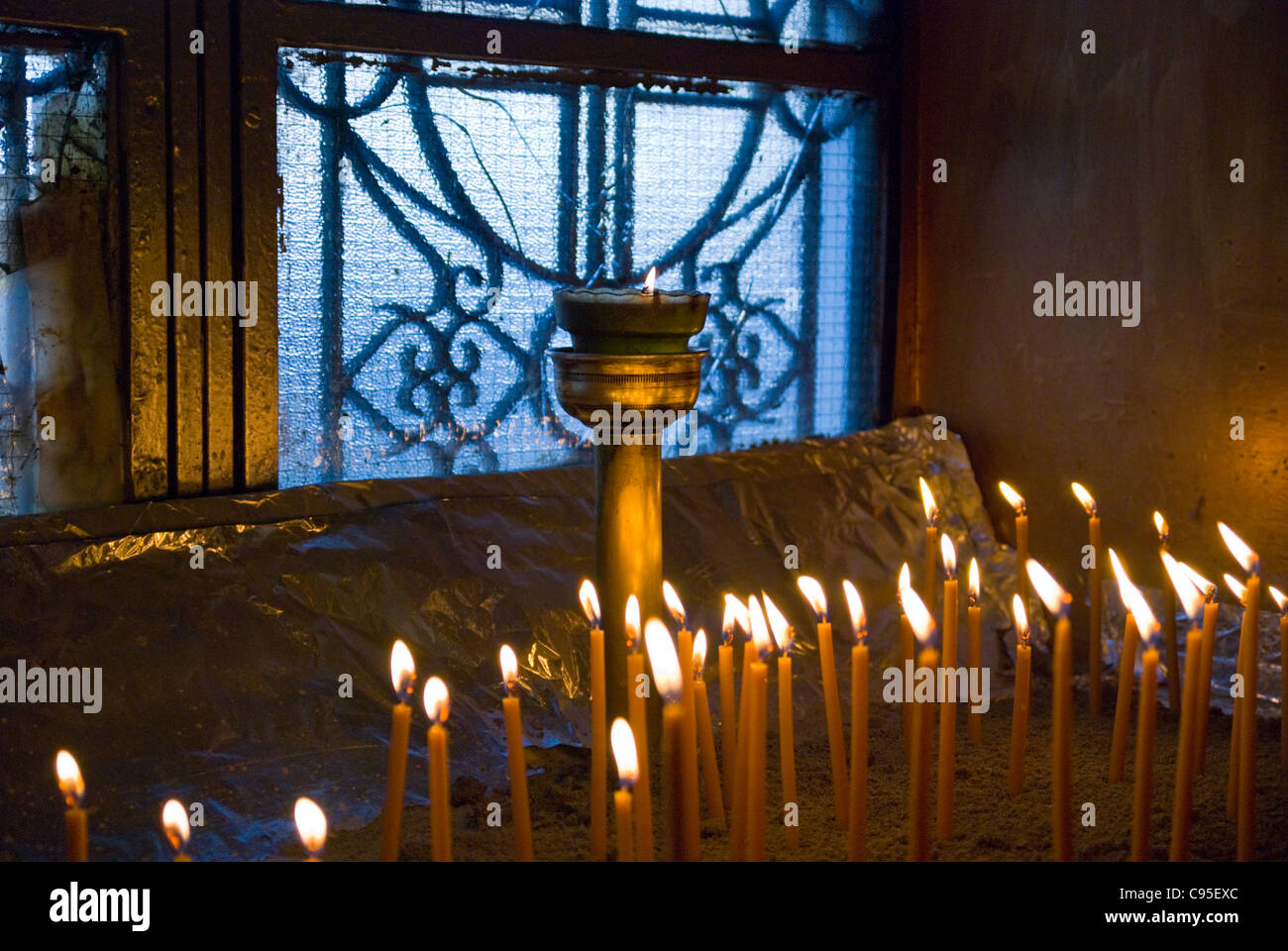 Burning candles in a Greek Orthodox Church Stock Photo - Alamy