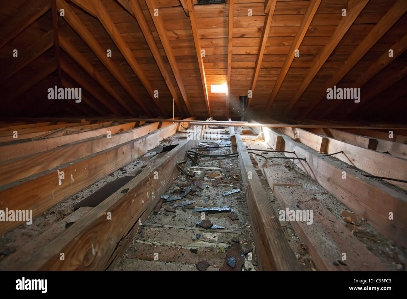 An uninsulated attic Stock Photo - Alamy